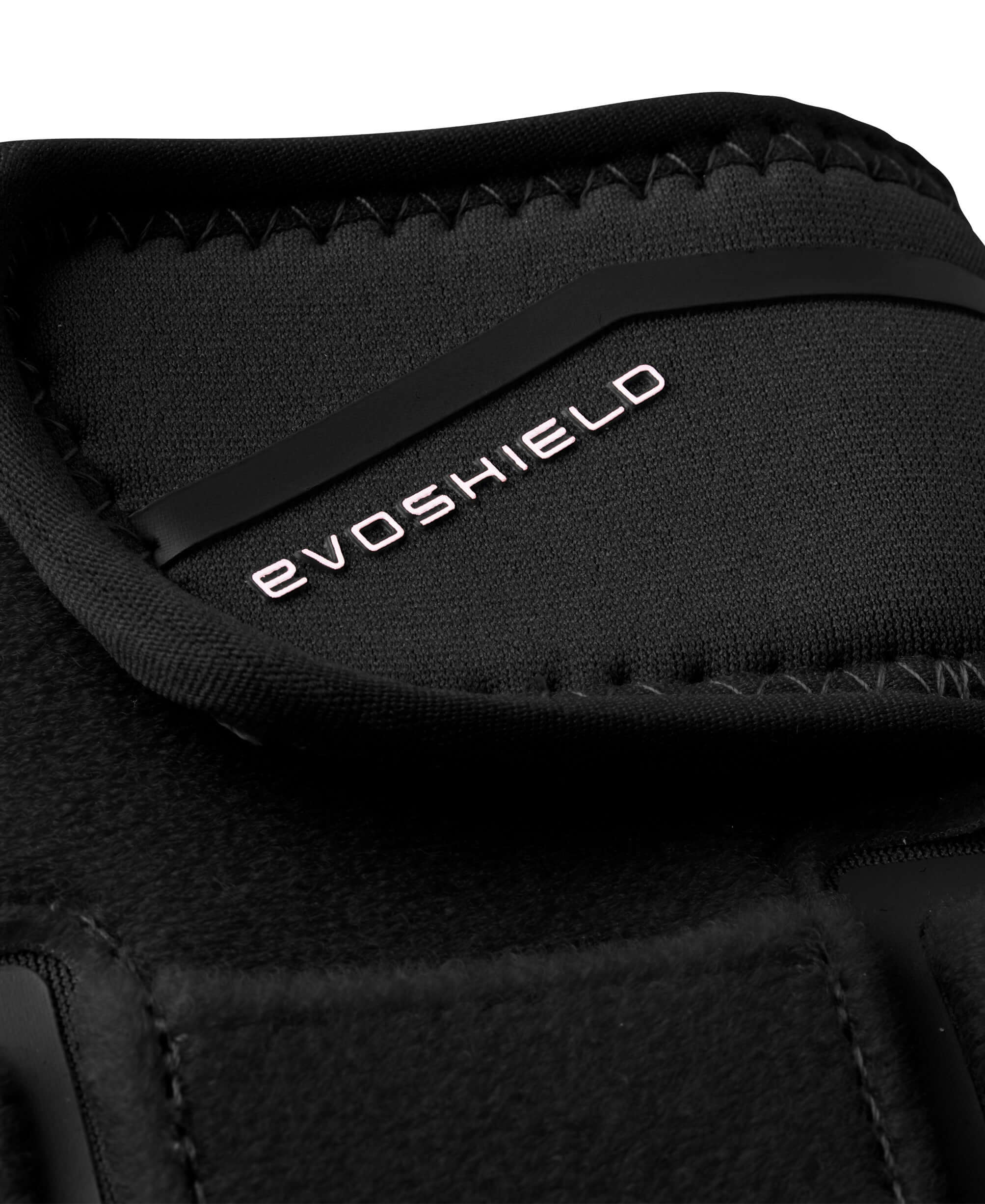 Close-up of EvoShield logo on black Evoshield Shorty Sliding Mitt 2.0 with visible stitching.