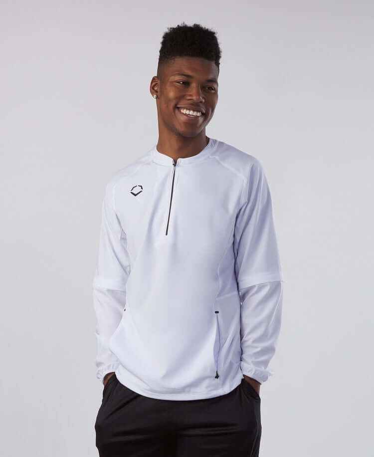 Young athlete wearing Evoshield Adult Long Sleeve BP Jacket in Team White, perfect for pre-game and practice.