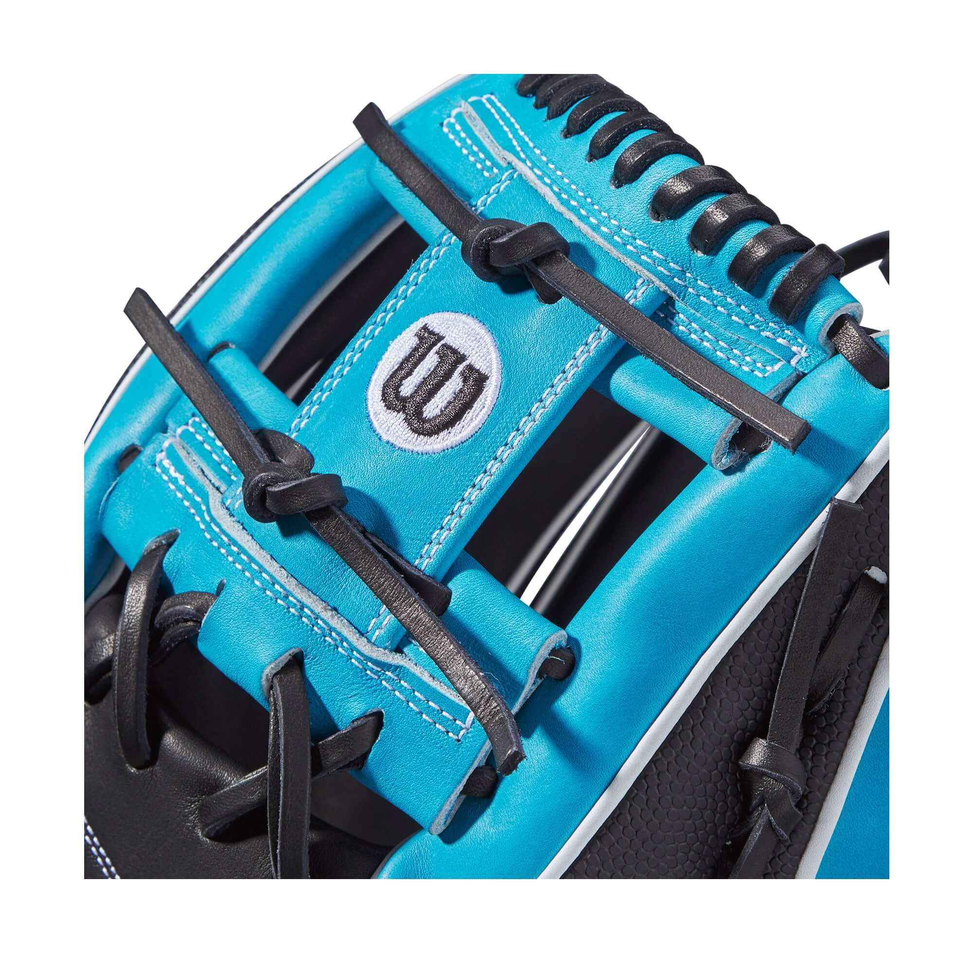 Close-up of Wilson S2000 1787 SS glove showcasing Tropical Blue Pro Stock Leather and Black SuperSkin.