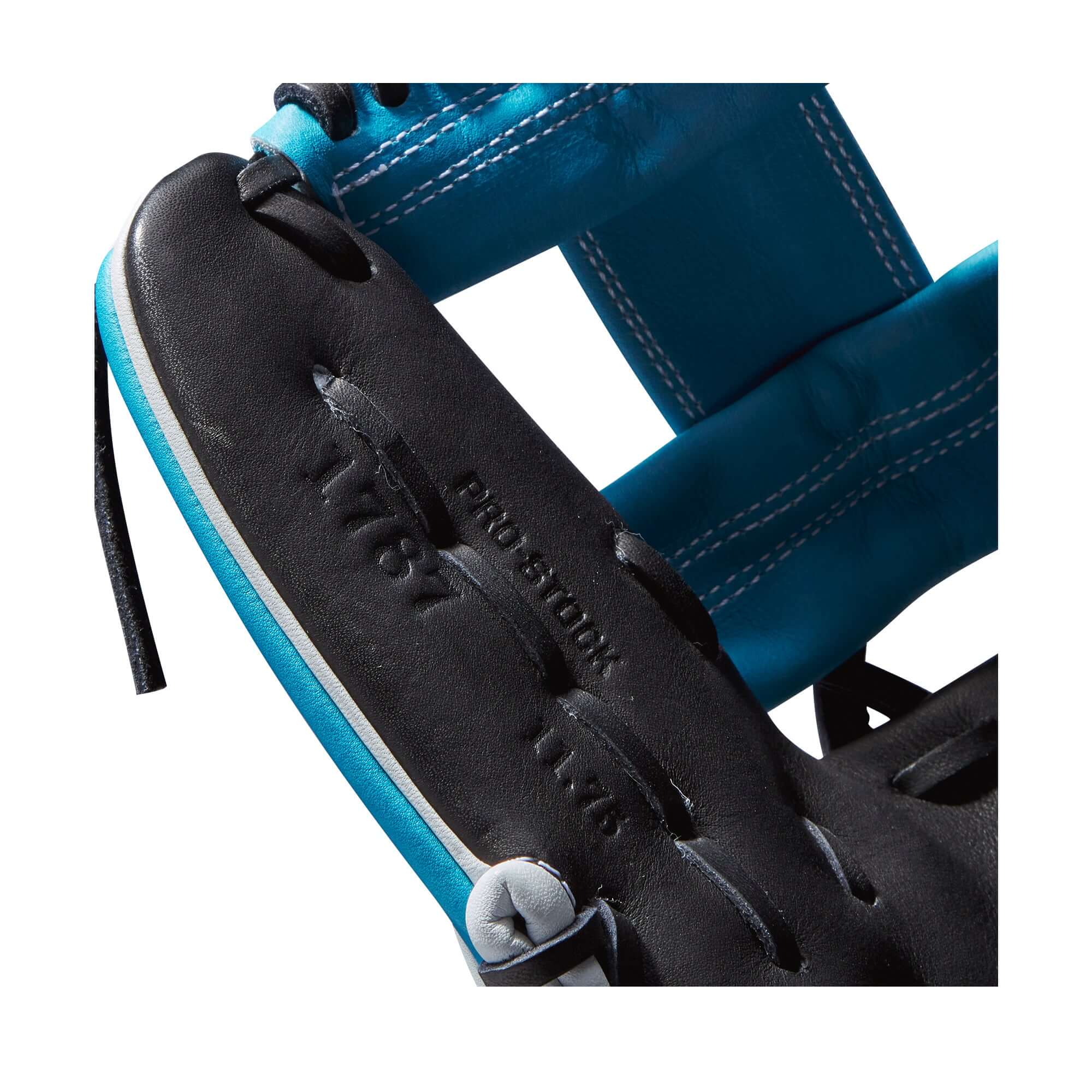 Close-up of Wilson A2000 1787SS glove showcasing Tropical Blue and Black Pro Stock Leather details.