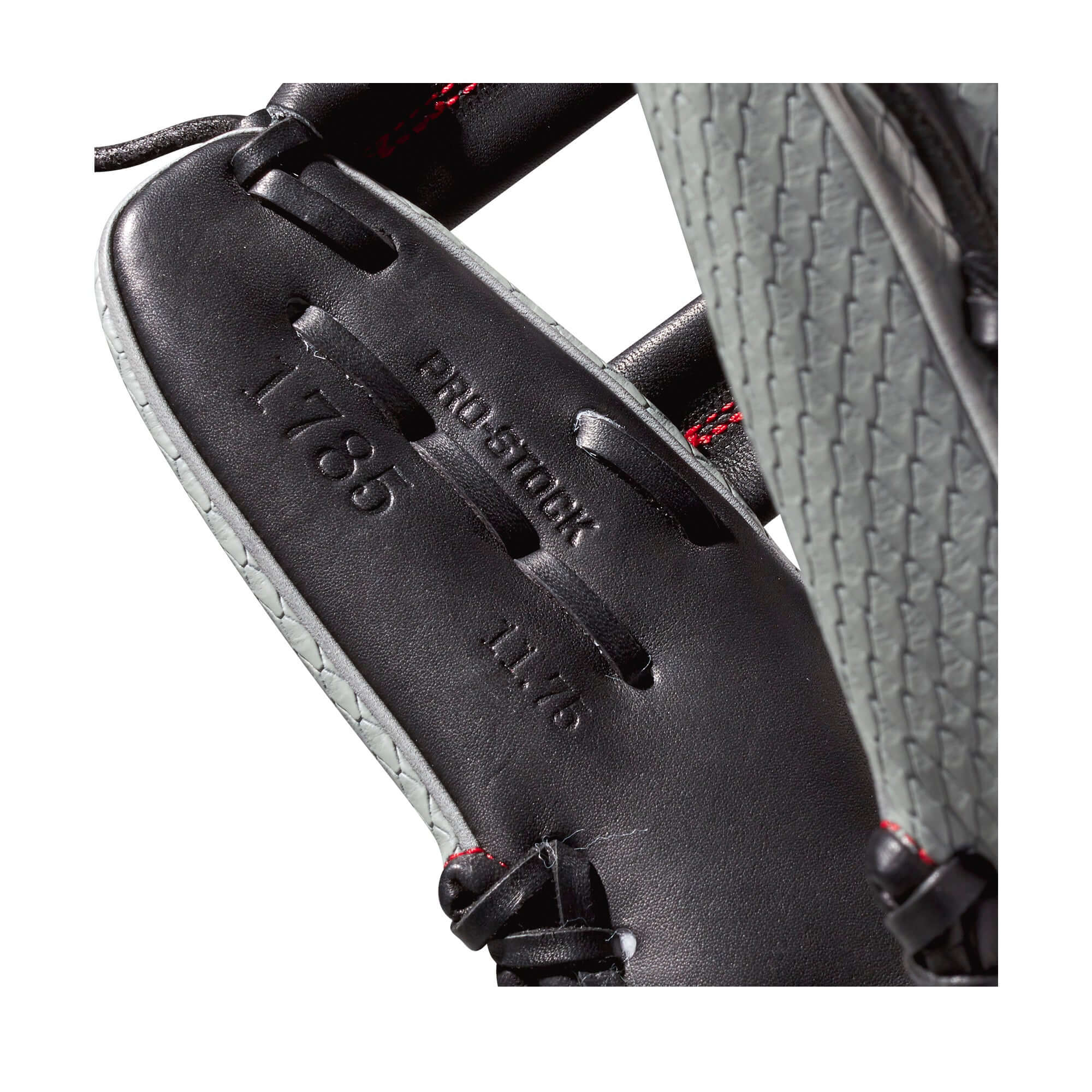 Close-up of Wilson A2000 1785 SS glove showcasing black Pro Stock leather and stitching details.