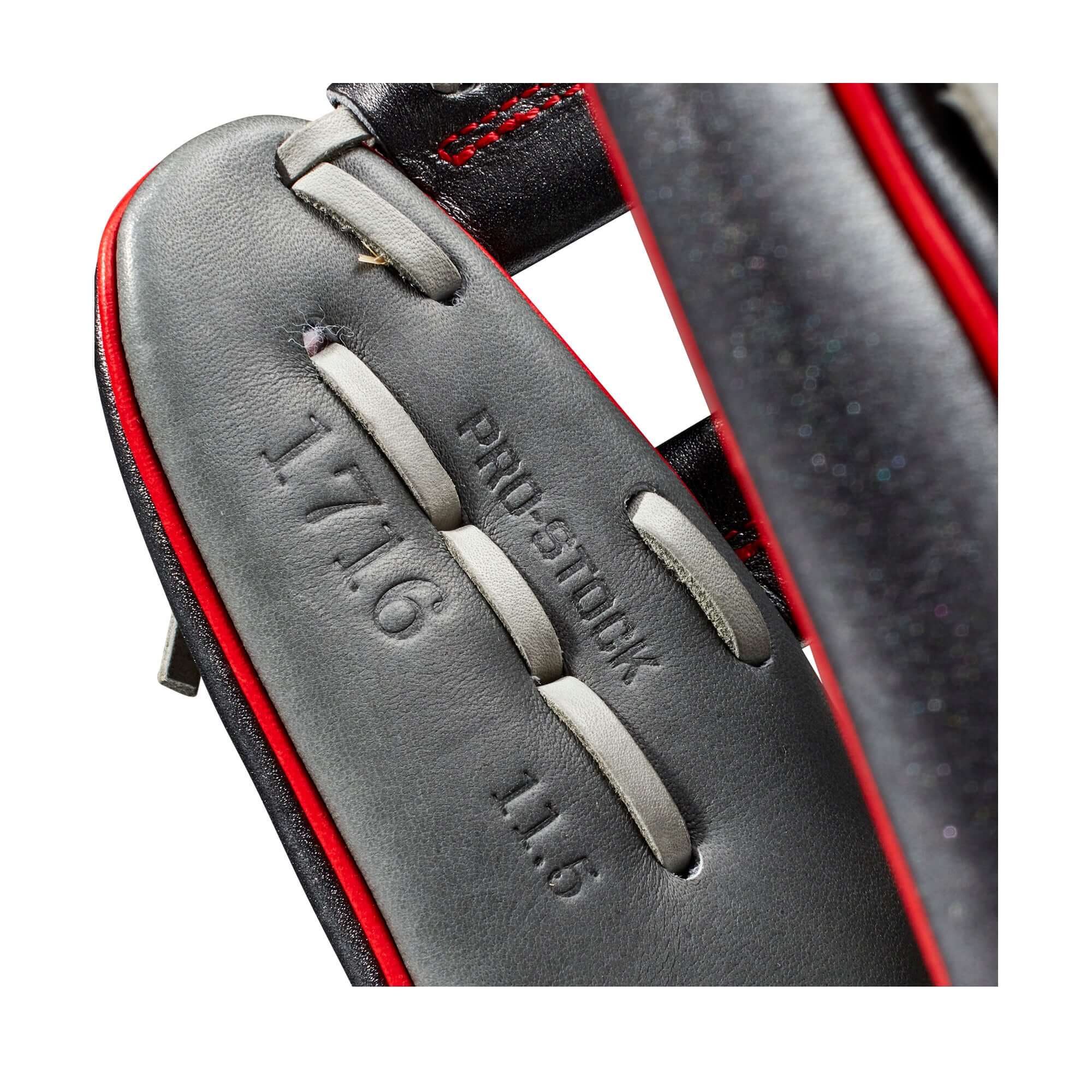 Close-up of the Wilson A2000 1716 glove features, showcasing Pro Stock, 11.5" size, and Chevron Cross Web design.