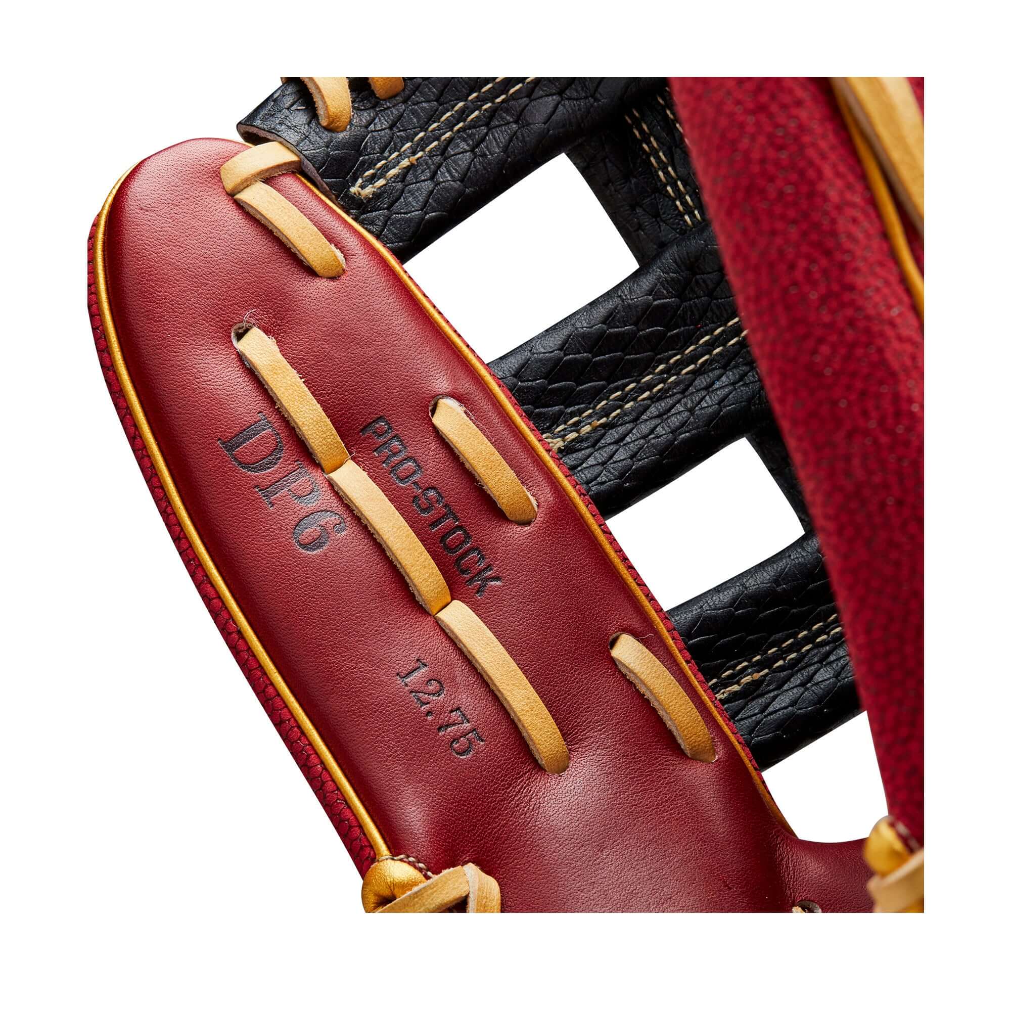 Interior view of Wilson A2000 12.75" baseball glove with DP6 Pro Stock label and red-black color scheme.