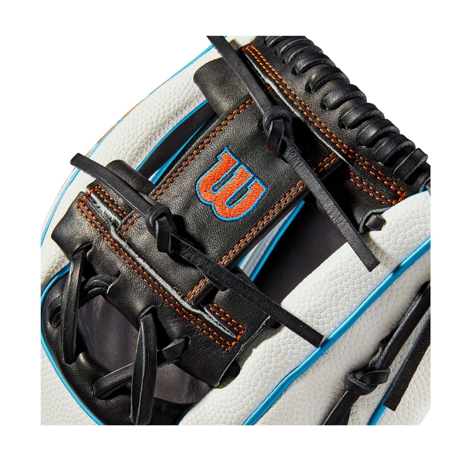 Close-up of Wilson A2000 1975 SS baseball glove in black and tropical blue with white accents.