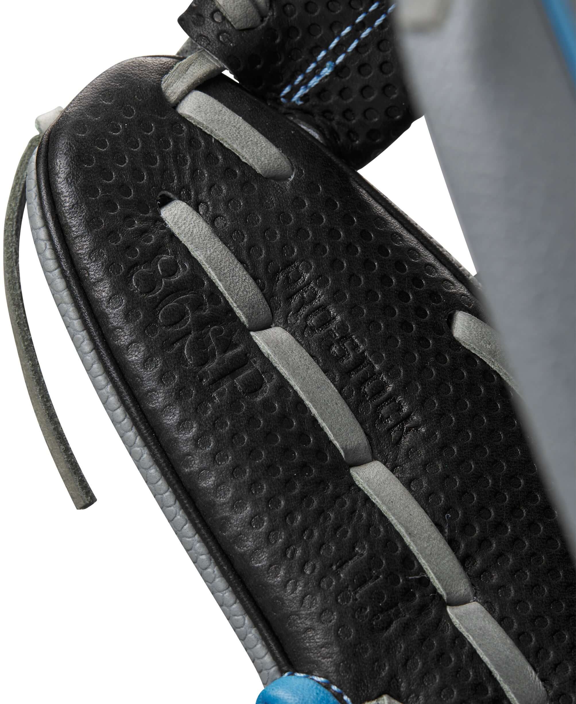 Close-up of the Wilson 2023 A2000 SC1786SS T1D 11.5" Infield Baseball Glove showing textured black leather and lace details.
