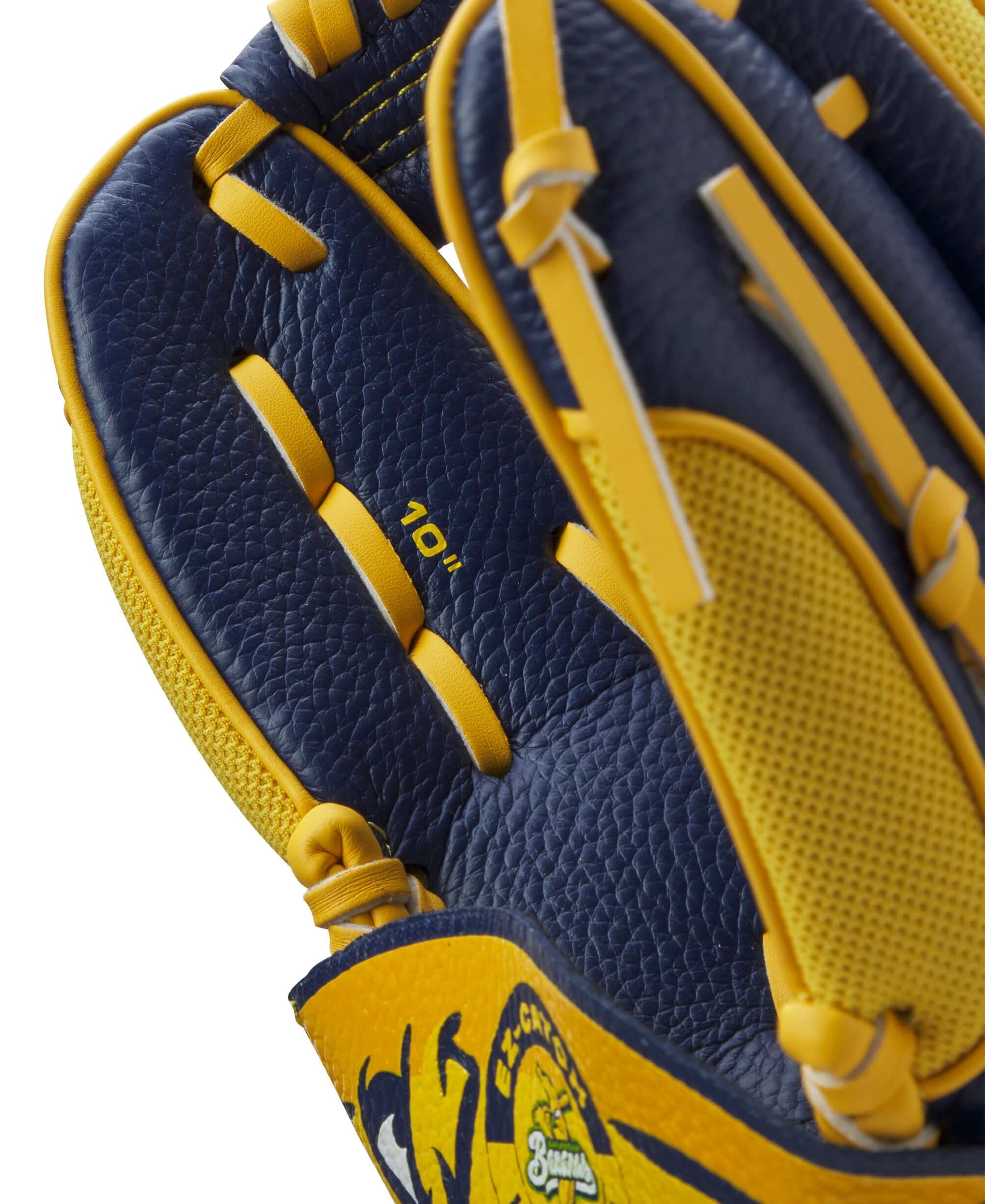 Close-up of the Wilson 2024 A200 EZ Savannah Bananas T-Ball Glove showing the 10" size and vibrant color design.