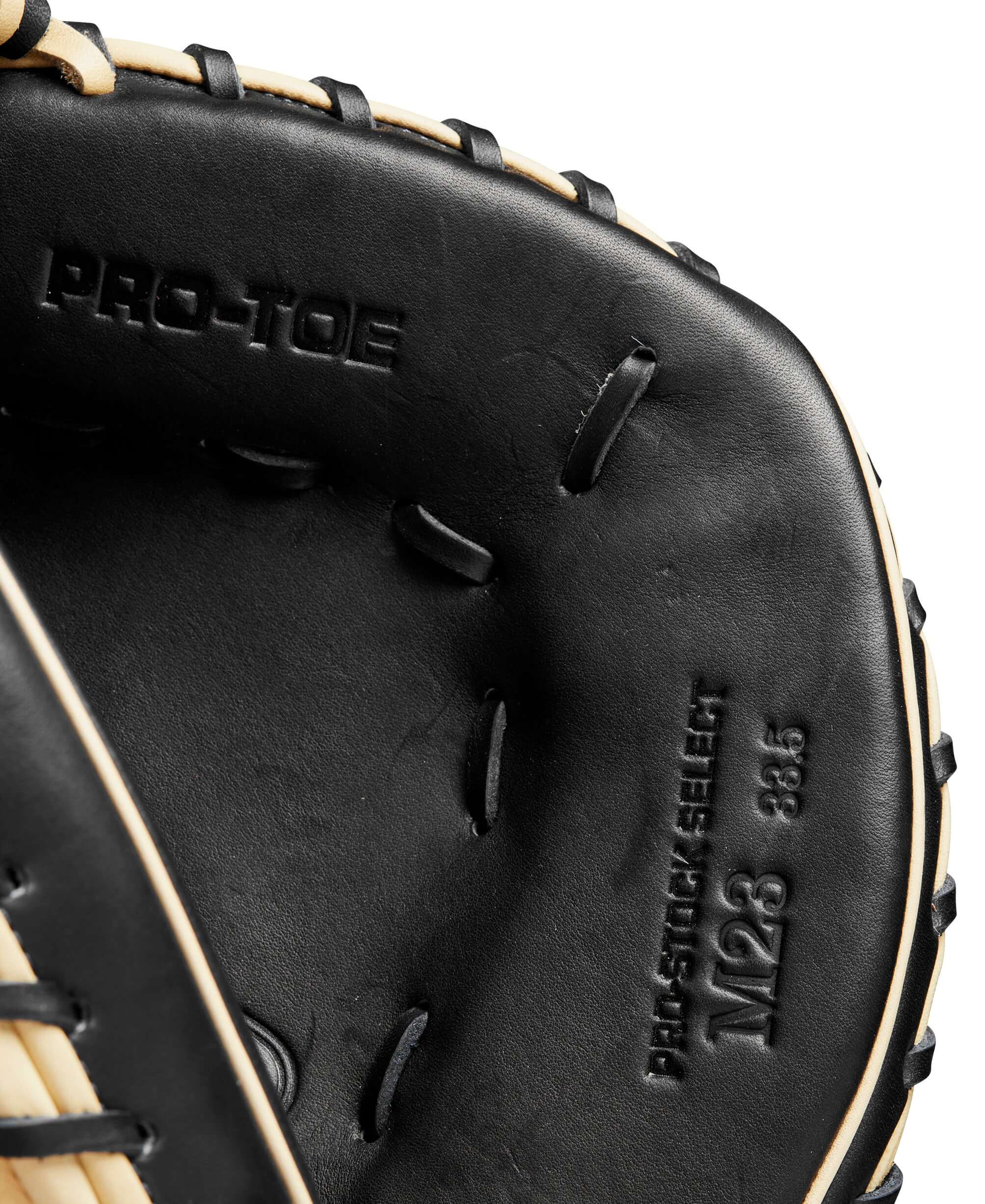 Inside view of Wilson A2K M23 catcher's mitt showing Pro Stock Select and Pro Toe details.