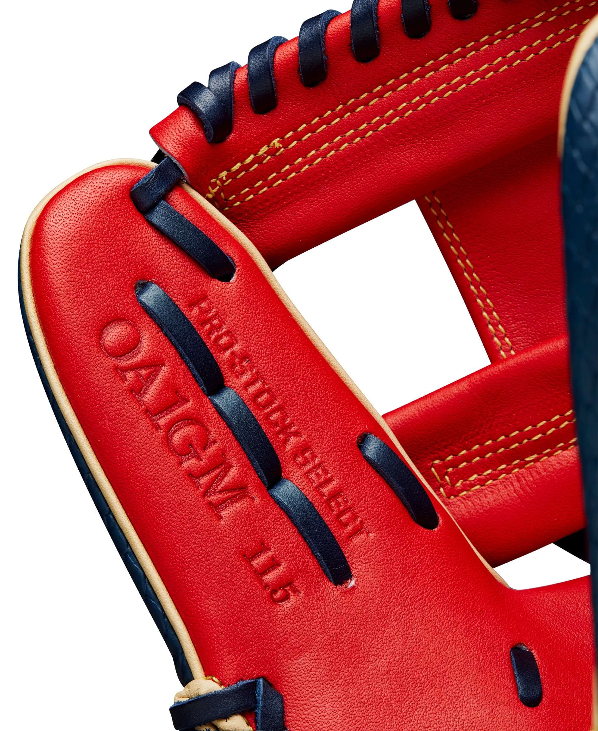 Close-up of Wilson A2K Ozzie Albies glove interior, showcasing red leather and stitching detail. 11.5 inches for enhanced control.