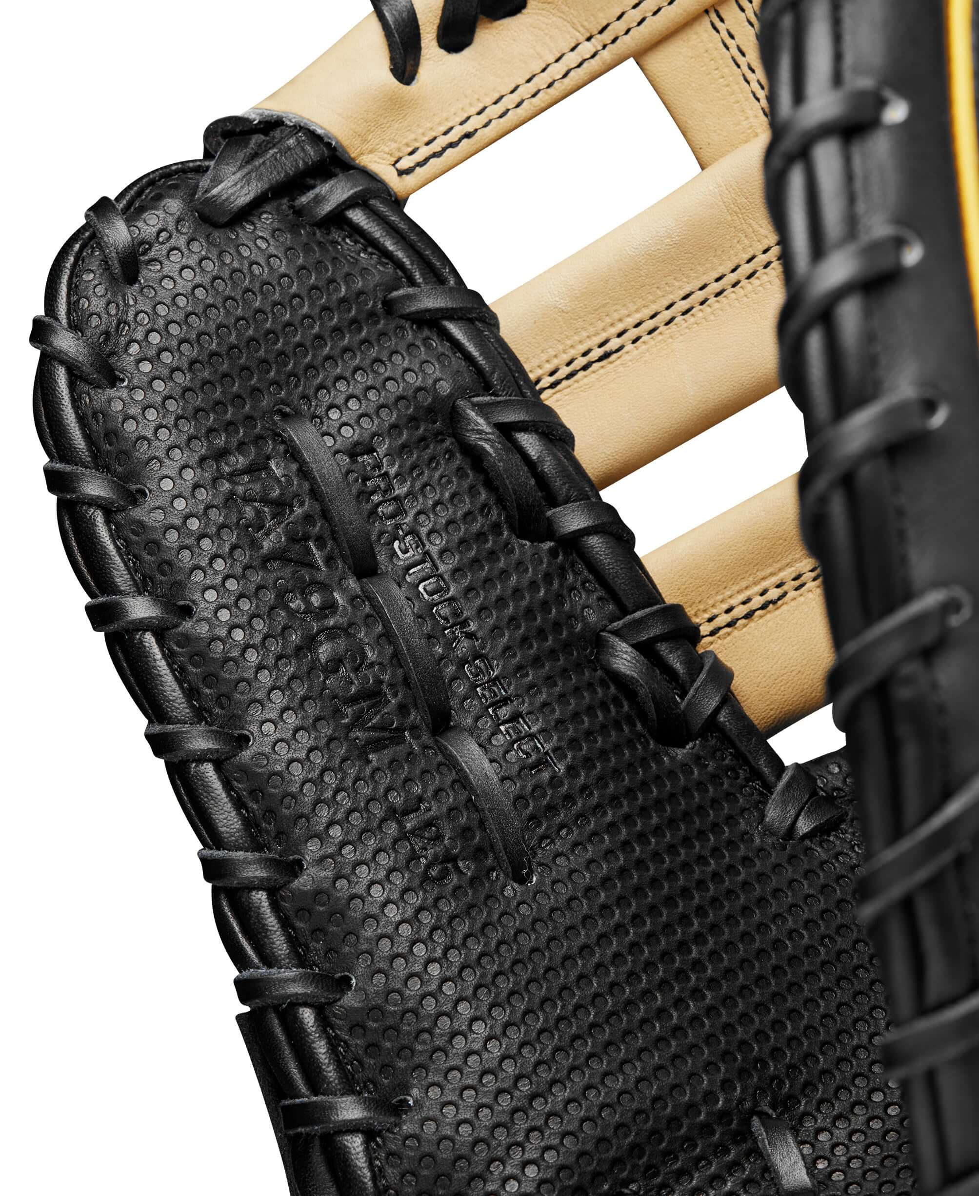 Close-up of Wilson A2K first base mitt showcasing Spin Control Technology and Black Pro Stock® Select leather details.