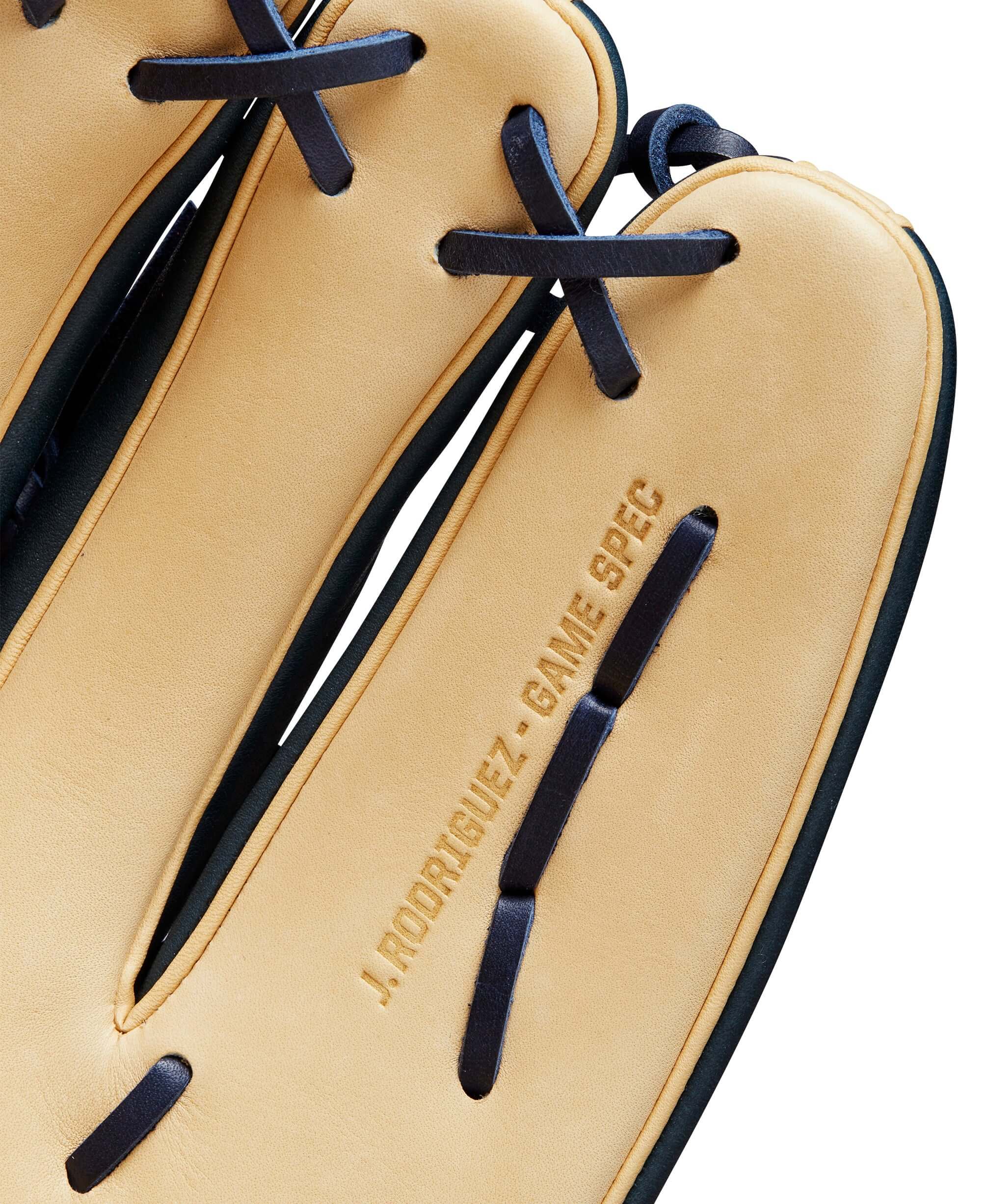 Close-up of Wilson 2024 Julio Rodríguez A2000 JR44 GM baseball glove showing leather details and game specification engraving.
