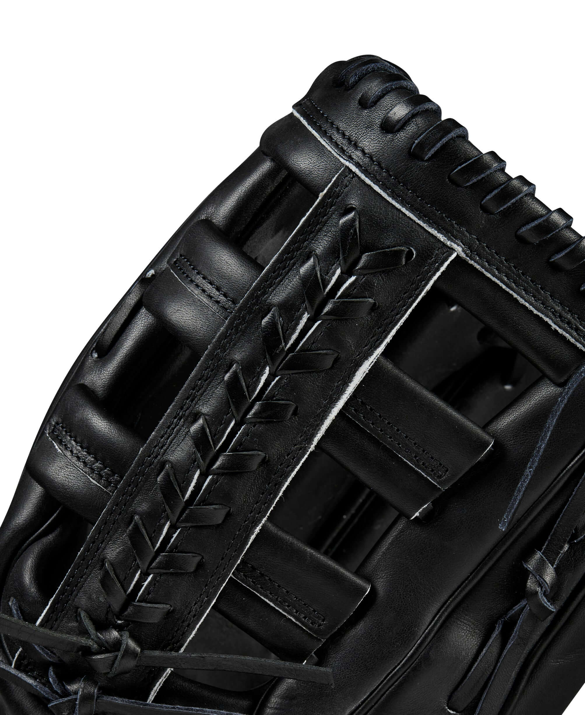 Close-up of the Wilson A2000 1810 outfield glove in black, showcasing the leather lacing and modified wrist strap design.