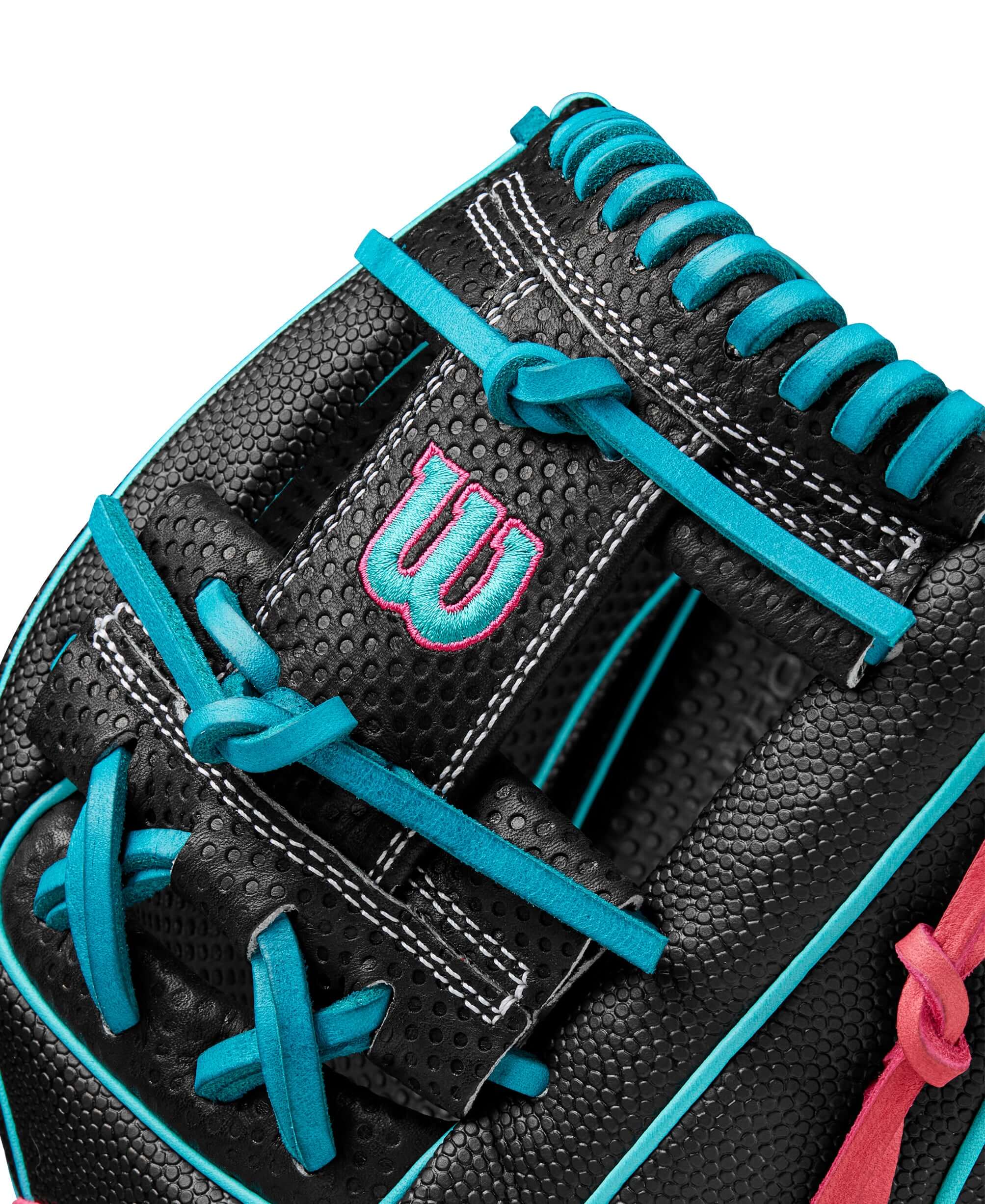 Close-up of Wilson A2000 1786SS glove showing black leather and teal accents for enhanced grip and performance.