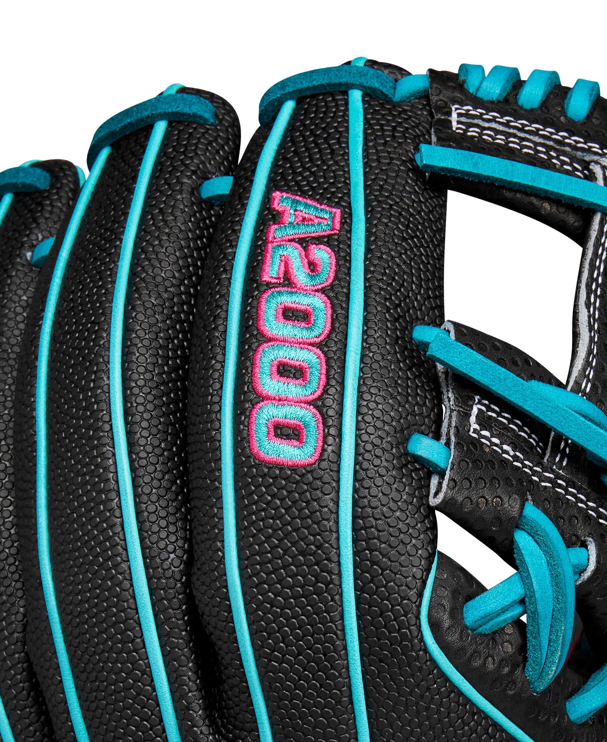 Close-up of Wilson A2000 glove featuring black leather with teal and pink accents, showcasing its unique Spin Control Technology.