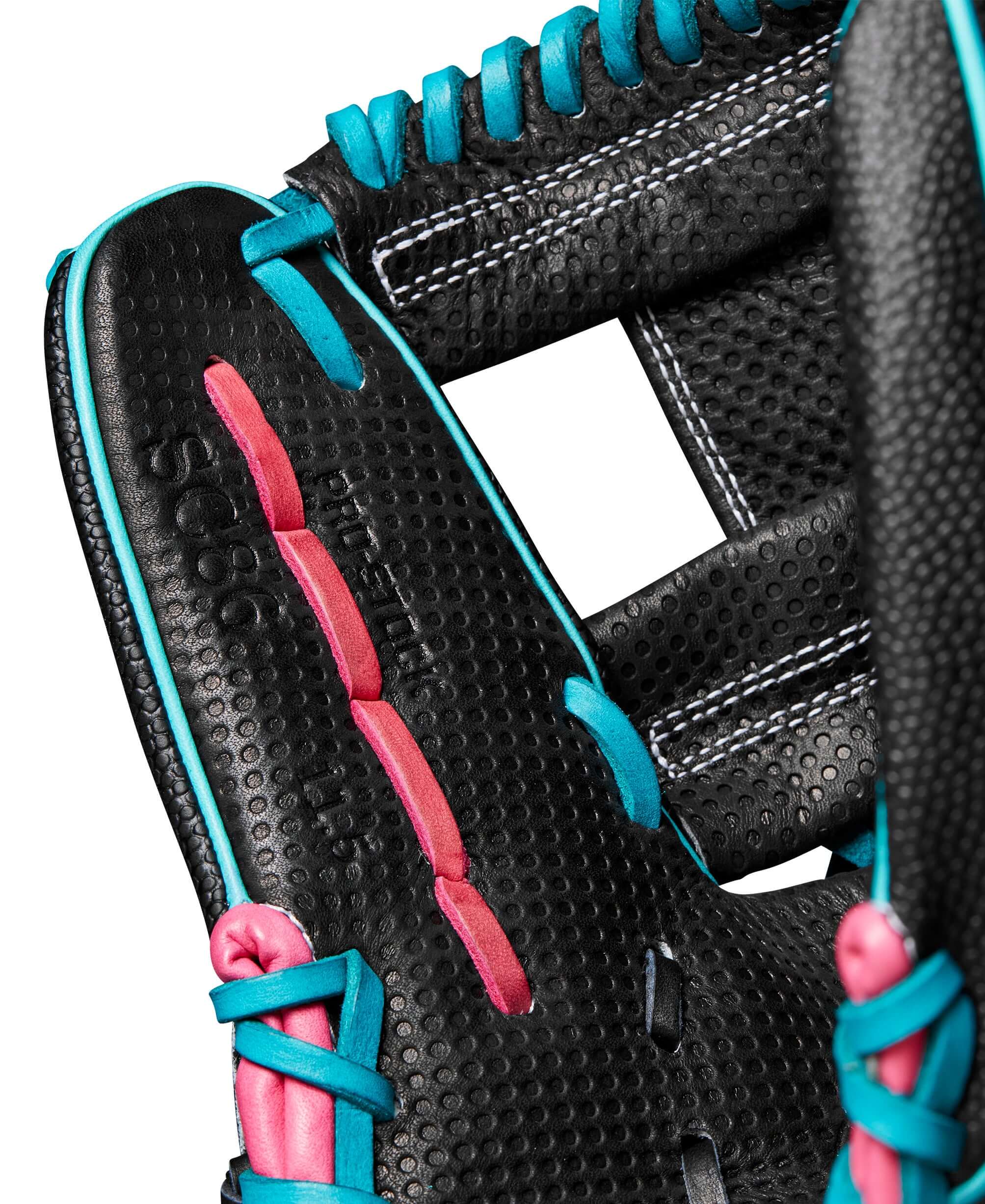 Close-up of Wilson A2000 glove interior showcasing black leather with teal and pink accents, featuring Spin Control Technology.