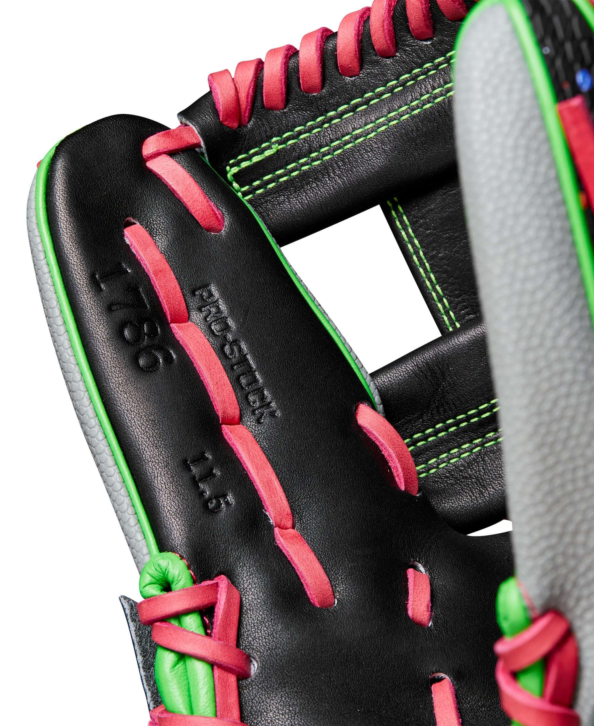 Close-up of Wilson A2000 1786SS baseball glove featuring vibrant black, pink, and green details.