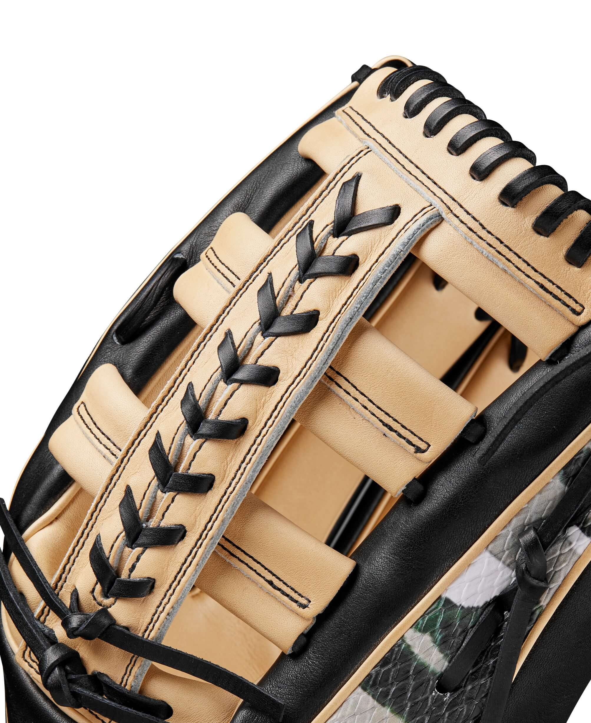Close-up of Wilson A2000 1810 glove showing leather palm and modified wrist strap for enhanced fit and control.