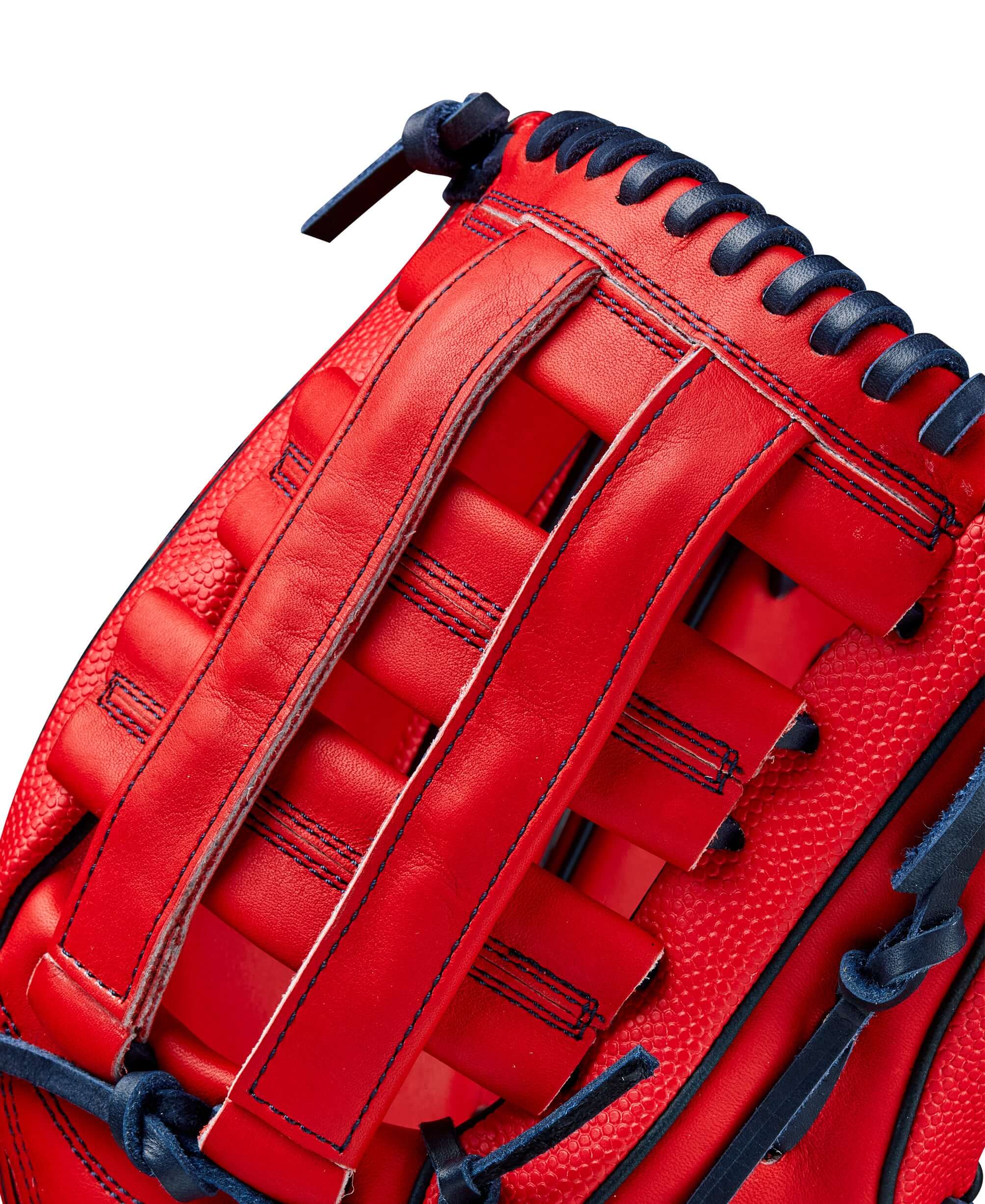 Close-up of the Wilson A2000 MY7 GM glove’s intricate red and navy leather design showcasing its craftsmanship.