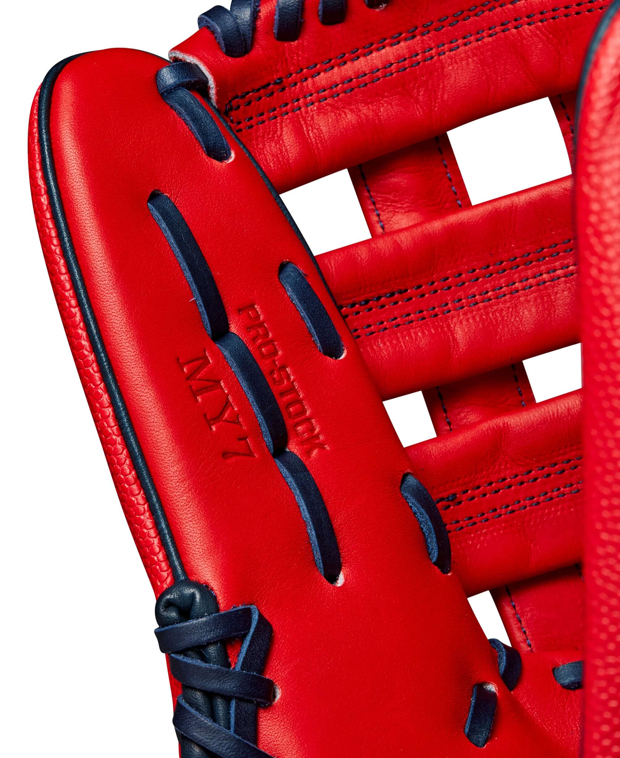 Close-up of Wilson A2000 MY7 glove showcasing red leather and navy stitching details, designed for outfielder Masataka Yoshida.