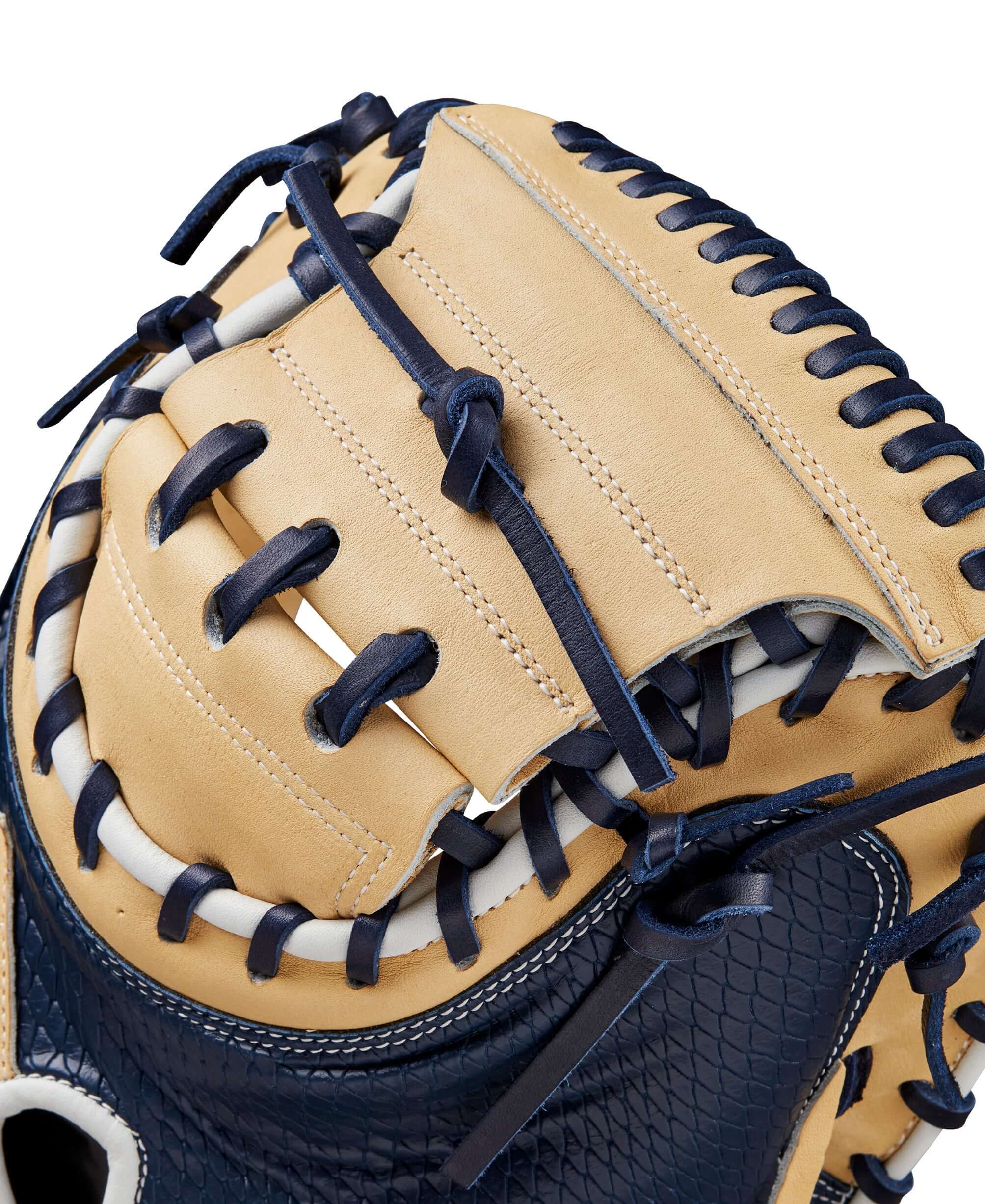 Close-up of Wilson A2000 SA34SS catcher's mitt in blonde and navy, showcasing finger pads and stitching details.