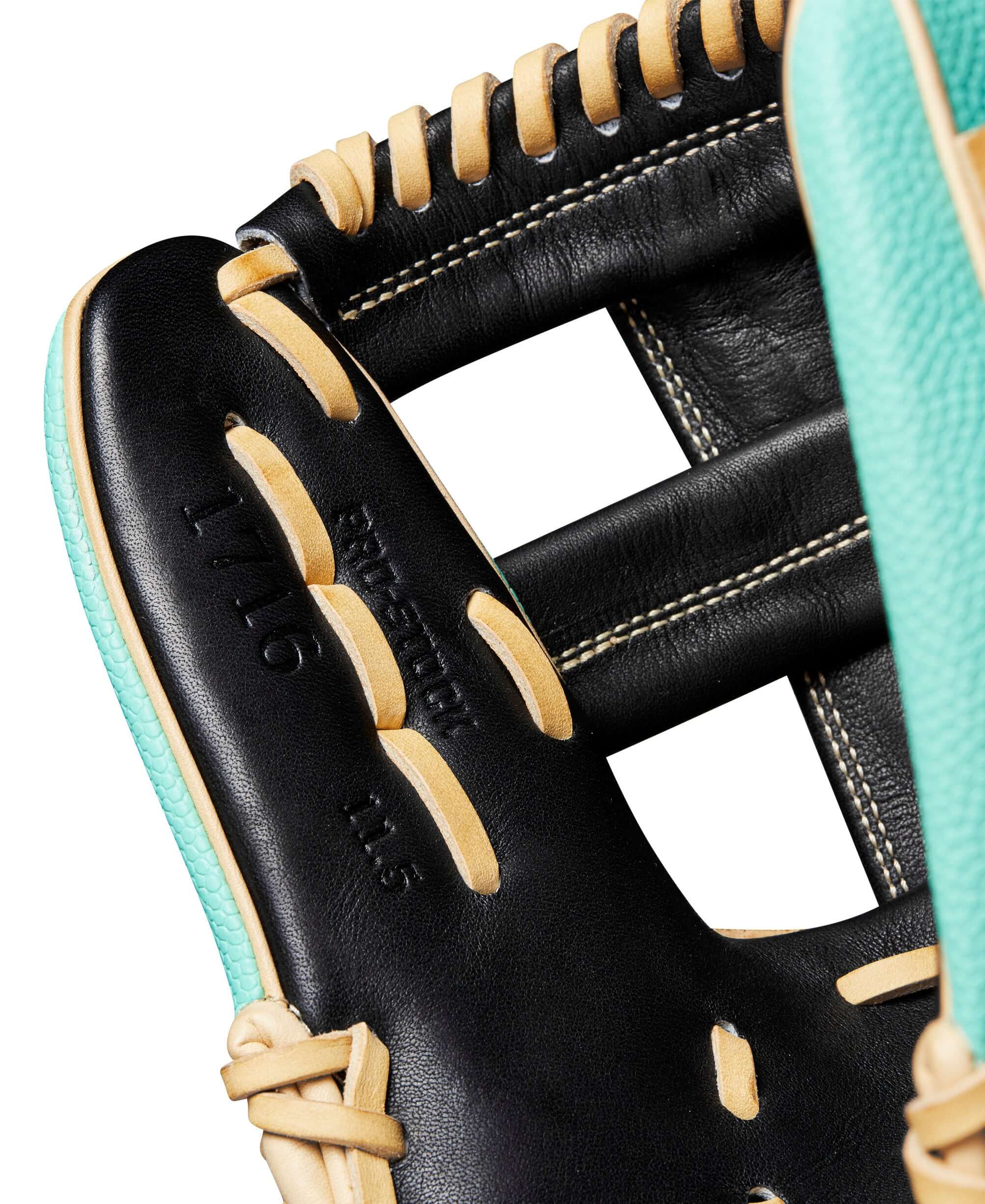 Close-up of Wilson A2000 1716SS glove, featuring Black Pro Stock leather and Seafoam SuperSkin™ details.