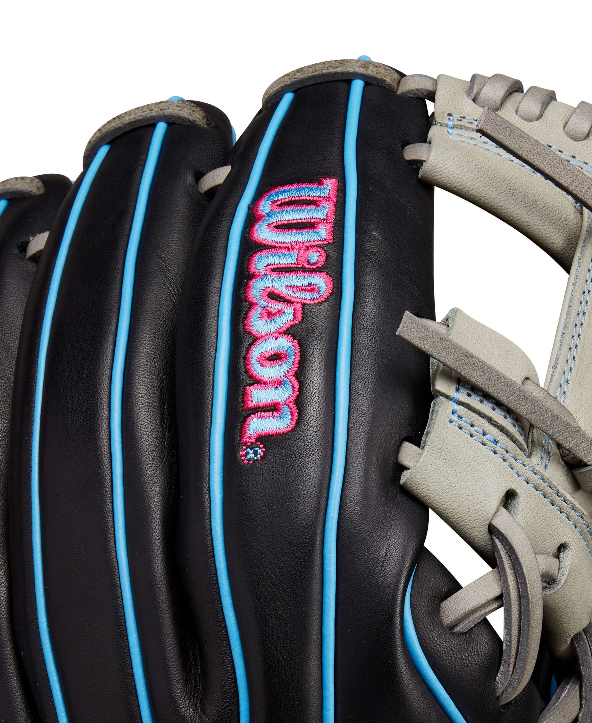 Close-up of Wilson A1000 DP15 glove showing sleek black leather with cool blue accents and the Wilson logo.