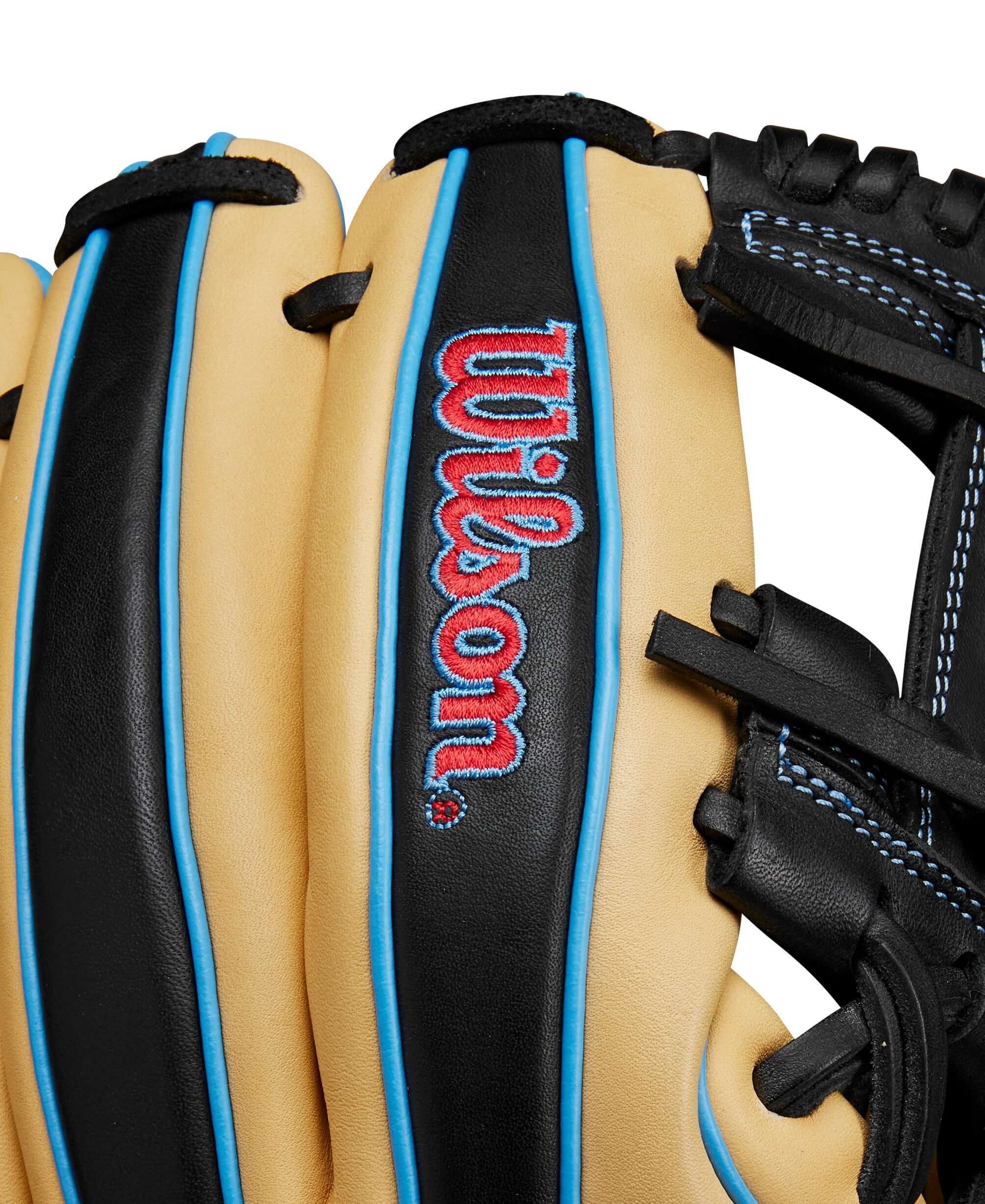 Close-up of the Wilson A1000® 1786 glove showcasing blonde and black leather with blue accents and logo.