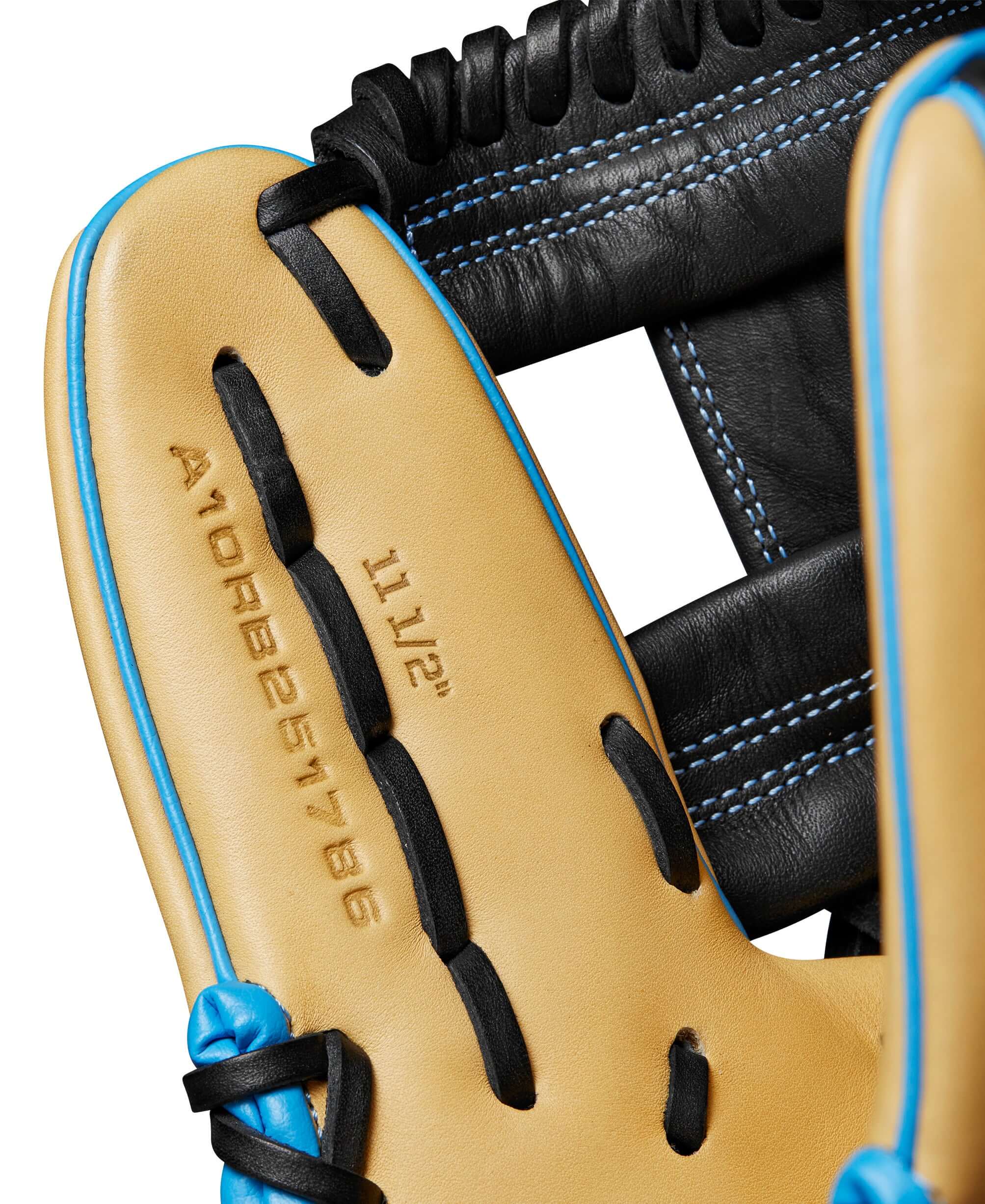 Close-up of the interior of the Wilson A1000® 1786 baseball glove showing size and design details in blonde and black leather.