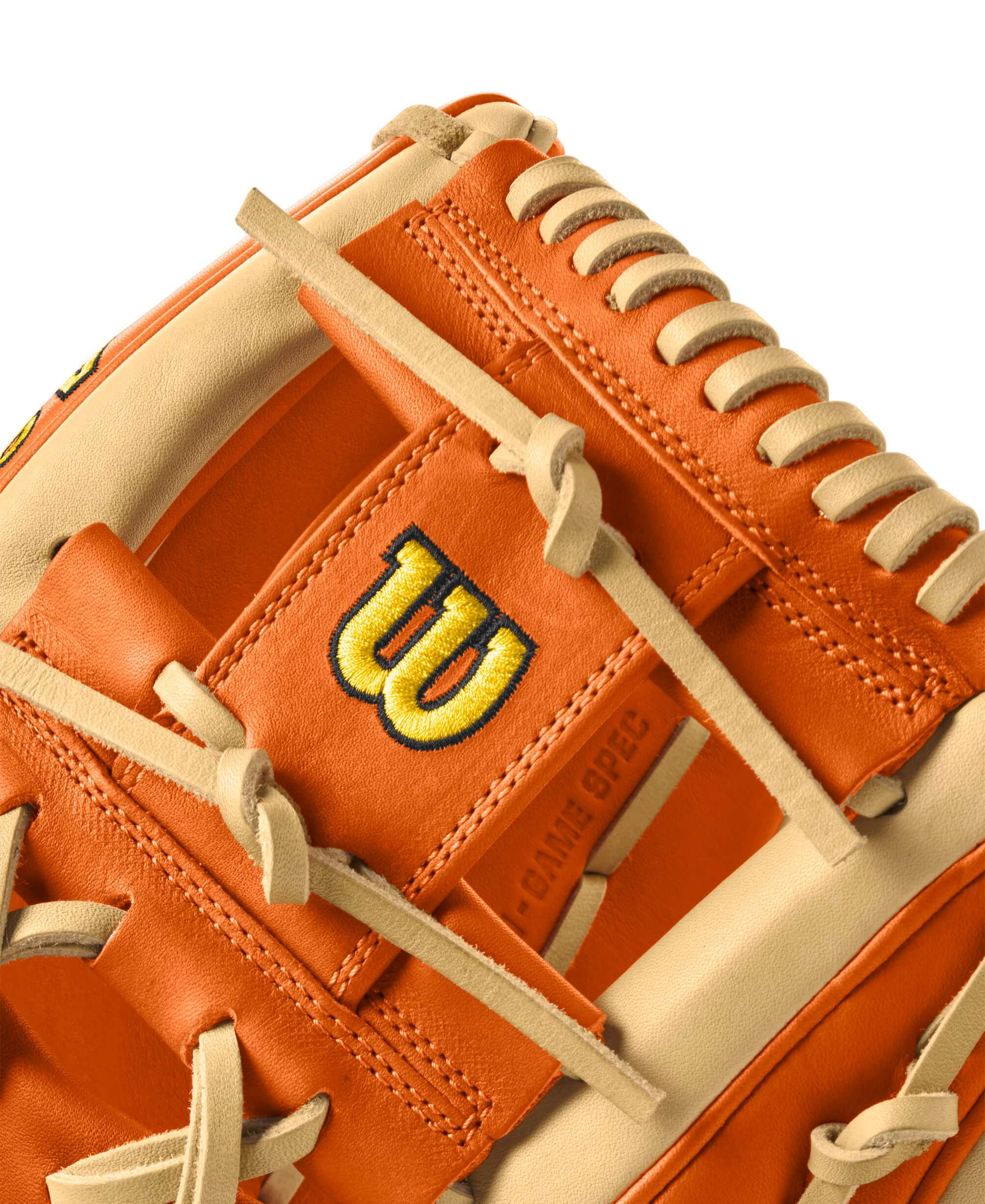 Close-up of Wilson A2K MC26 glove in orange tan and blonde leather with signature logo and lacing details, ideal for infield play.