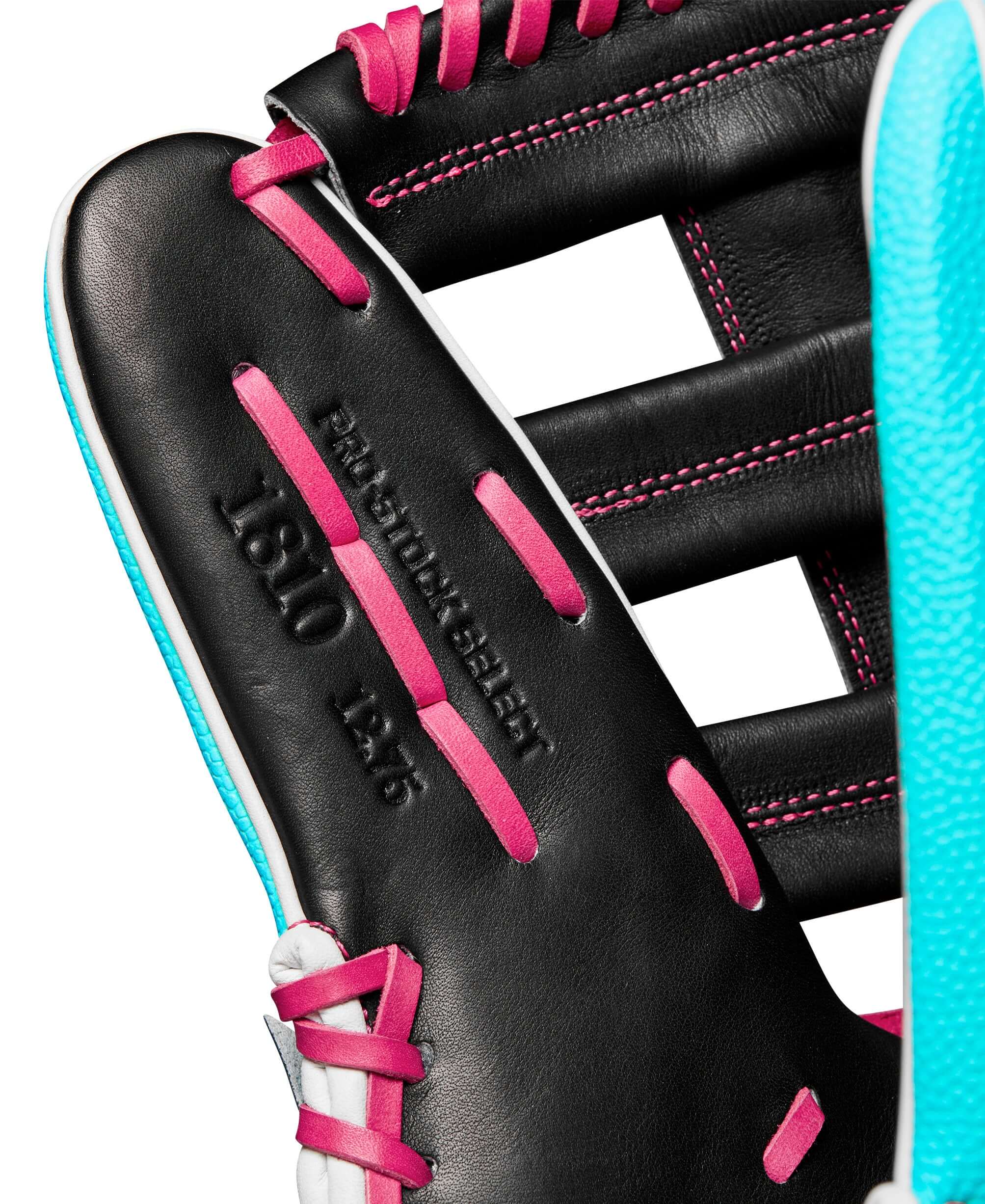 Close-up of the Wilson A2K 1810SS glove showing Black Pro Stock leather and teal SuperSkin details.