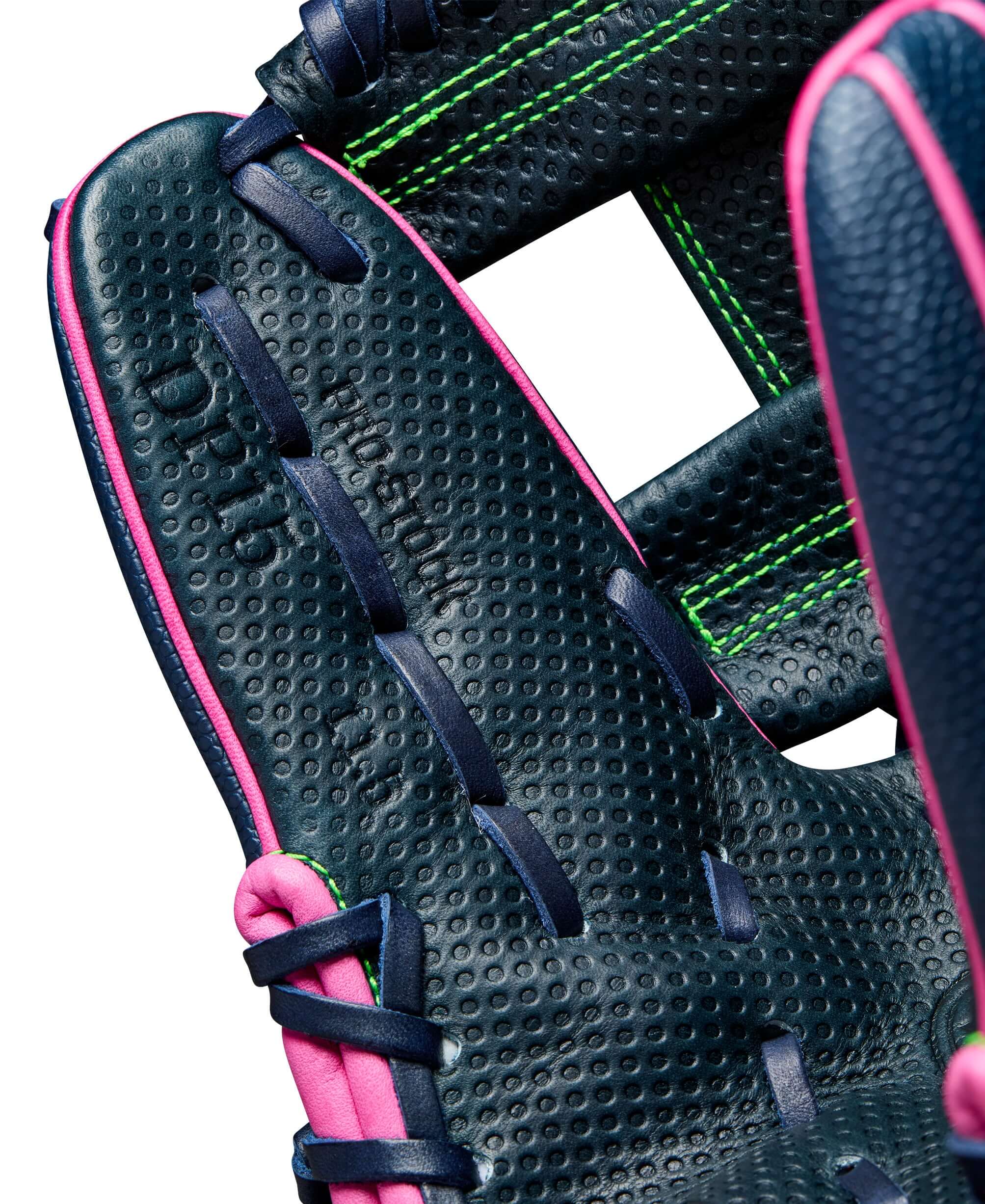 Close-up of the Wilson A2000 DP15SS glove, showcasing Navy Blue and Pink design, perfect for infielders with smaller hands.