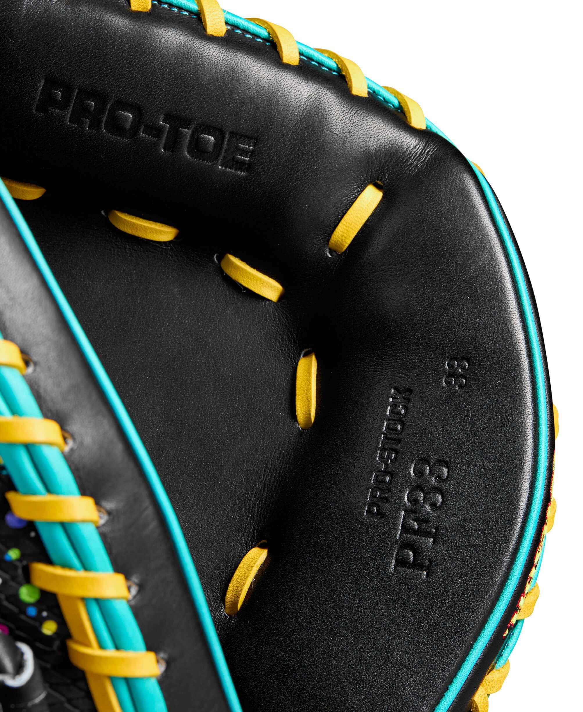 Close-up of Wilson A2000 PF33SS catcher's mitt showcasing the Pro-Toe and vibrant color accents.