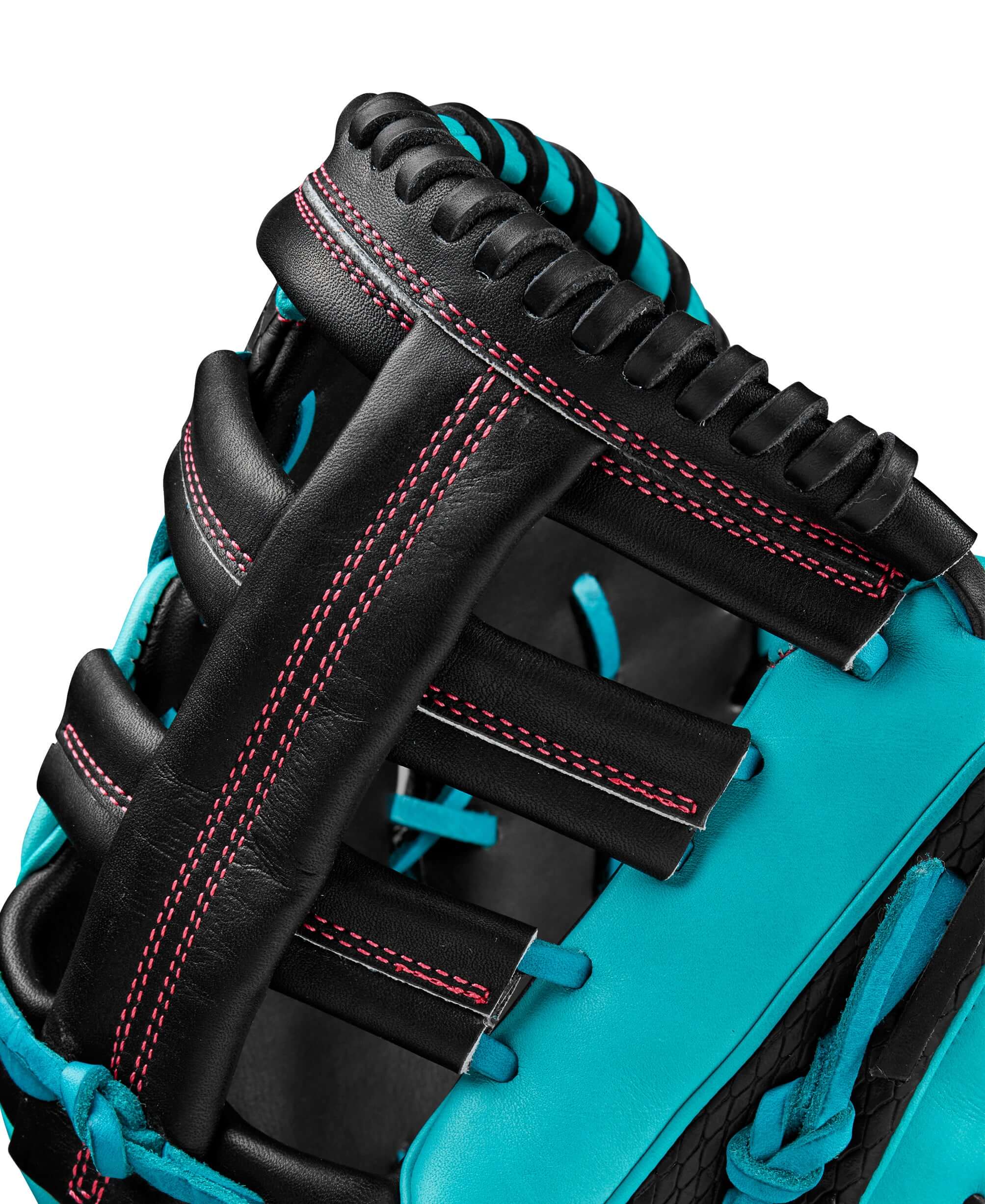 Close-up of Wilson A2K 1679CF mitt showcasing black and teal leather, featuring detailed stitching for durability.