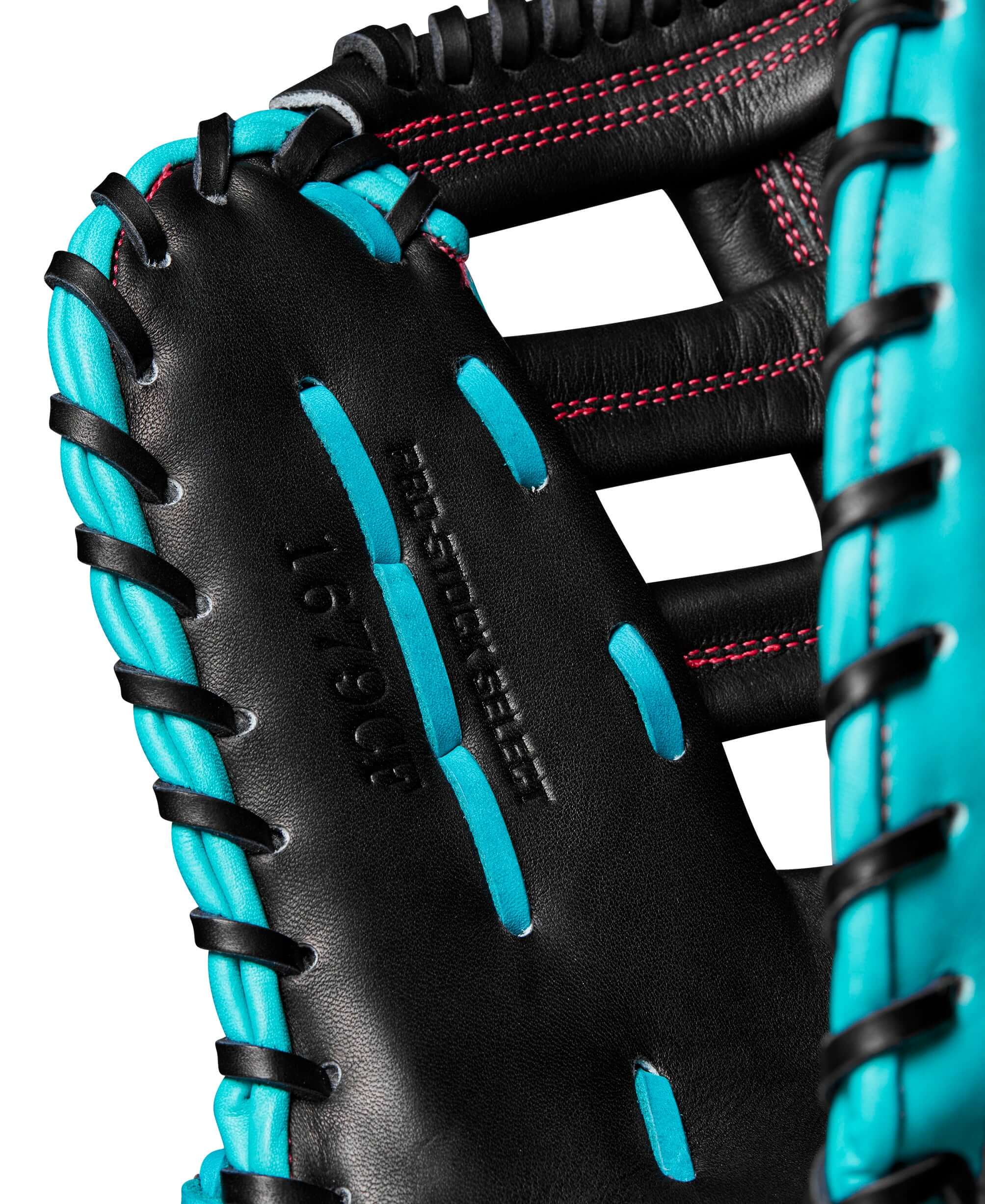 Front perspective of the thumb on the Wilson A2K 1679SS, highlighting secure grip and sleek Black/Teal design
