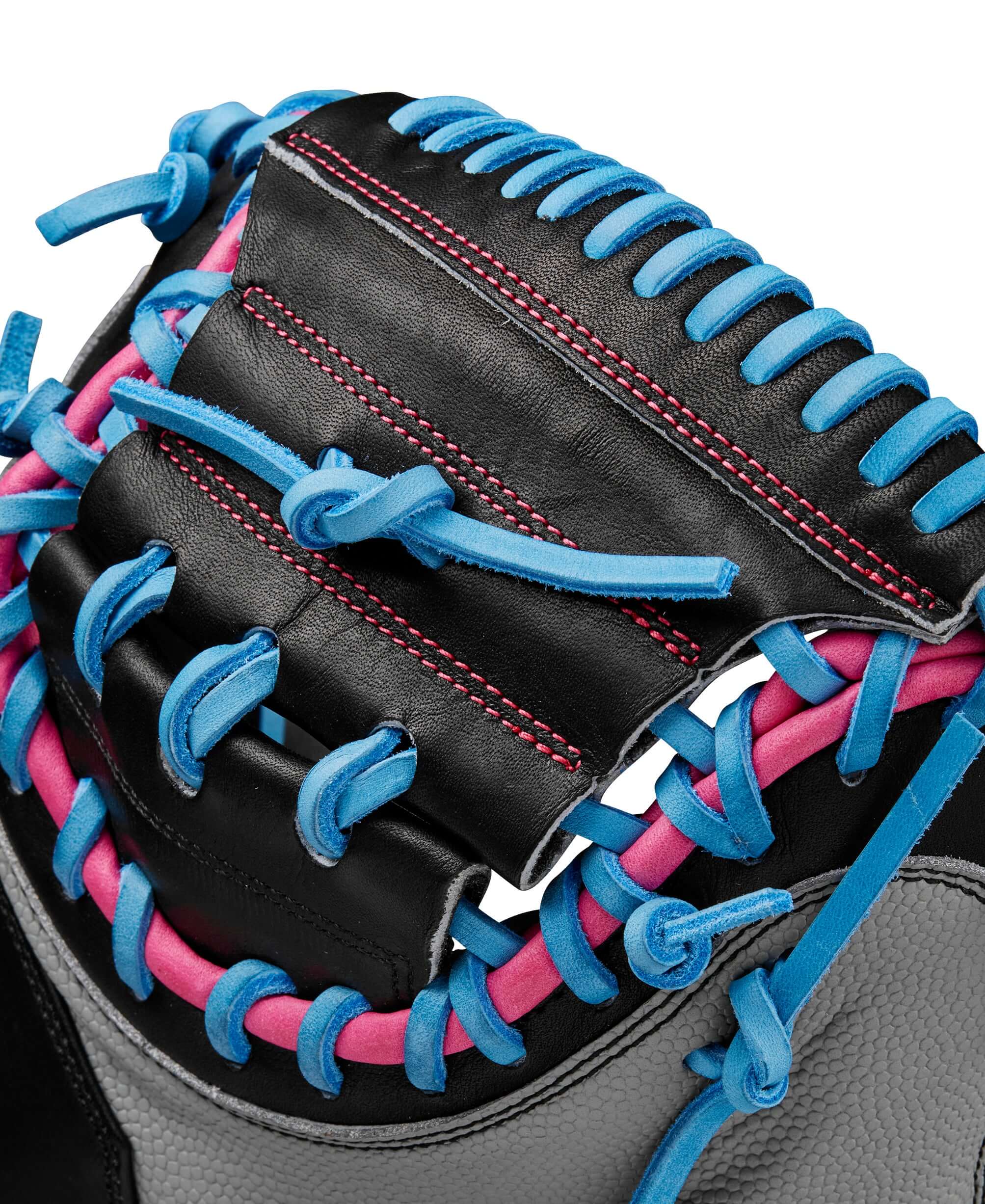 Close-up view of Wilson Spring 2025 A2000 M23 CMSS catcher’s mitt with vibrant lacing details and high-quality leather.