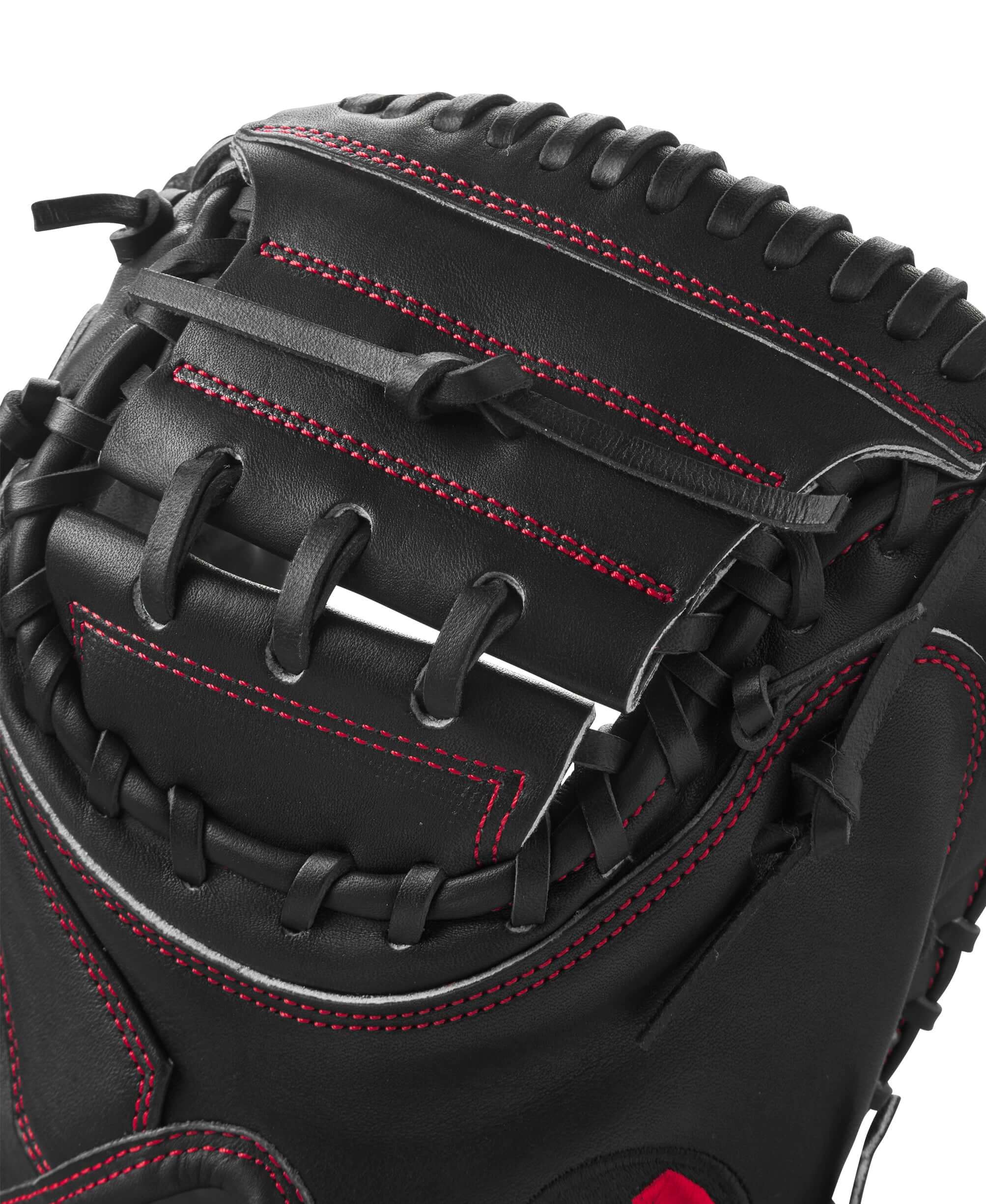 Close-up of Wilson A2K CW12 catcher’s mitt showing black leather and red stitching detail.