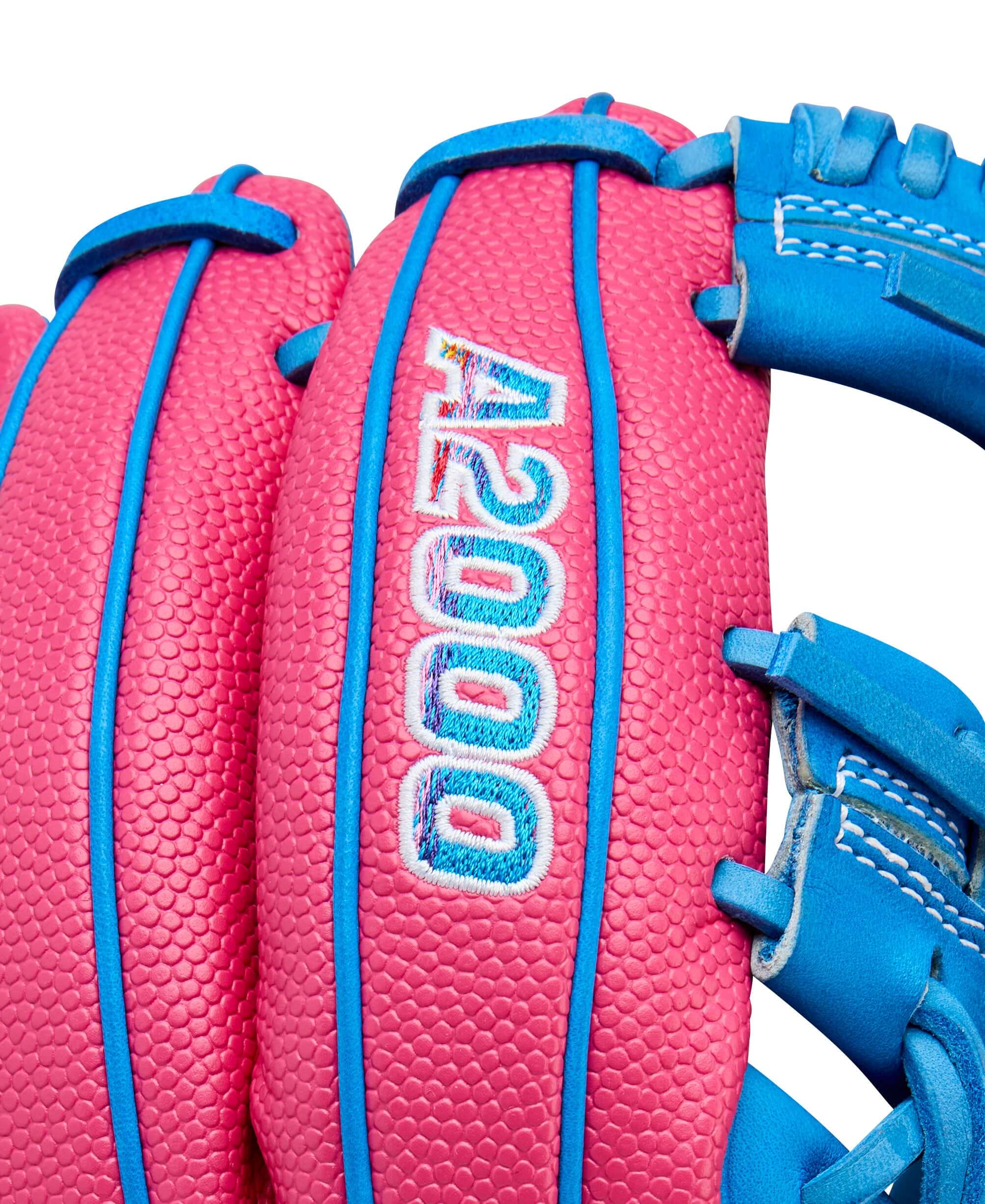 Close-up of Wilson A2000 1786SS baseball glove featuring vibrant pink and blue colors.