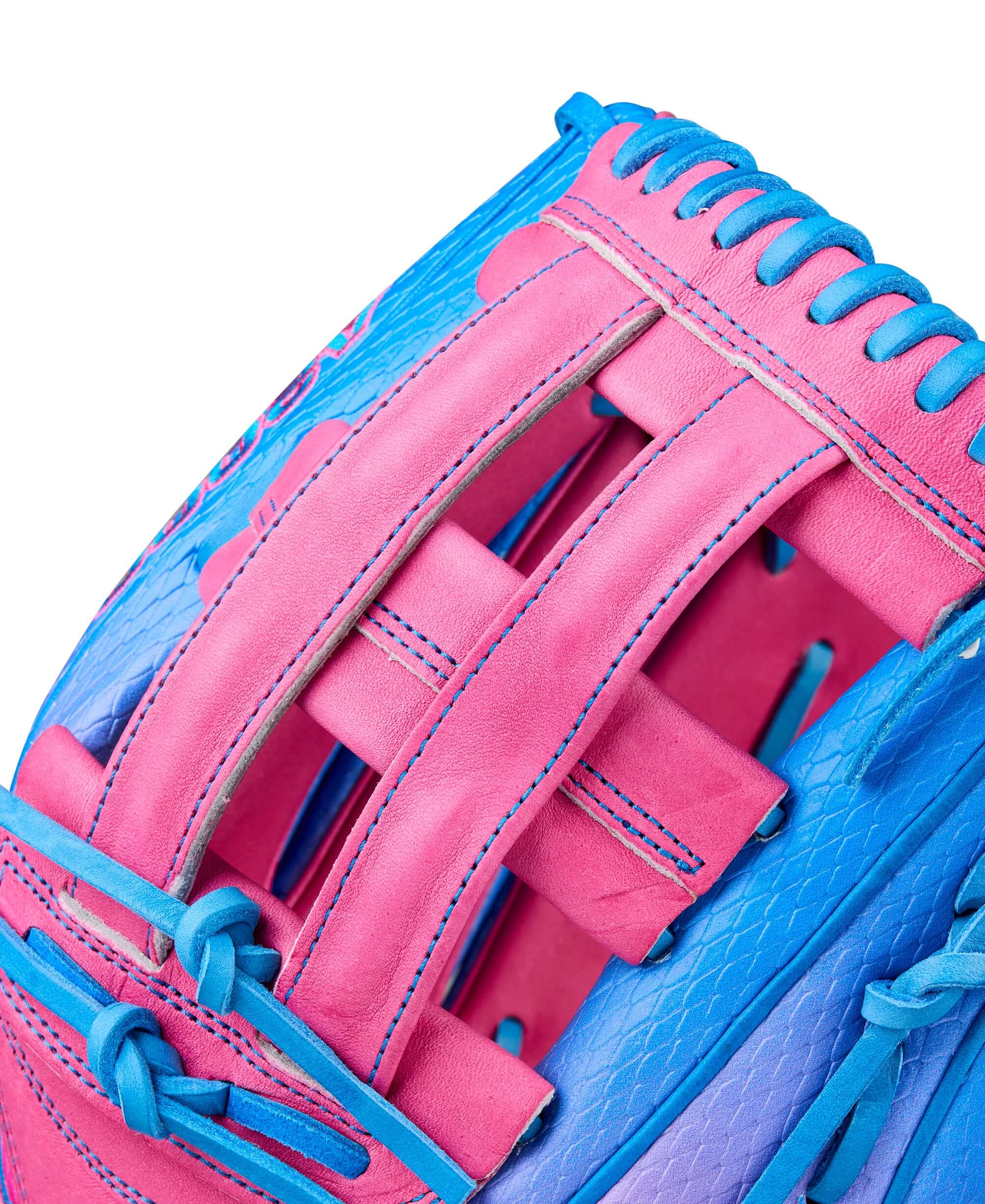 Close-up of Wilson 2025 Love the Moment A2000 1777SS outfield baseball glove in Flamingo Pink and blue.