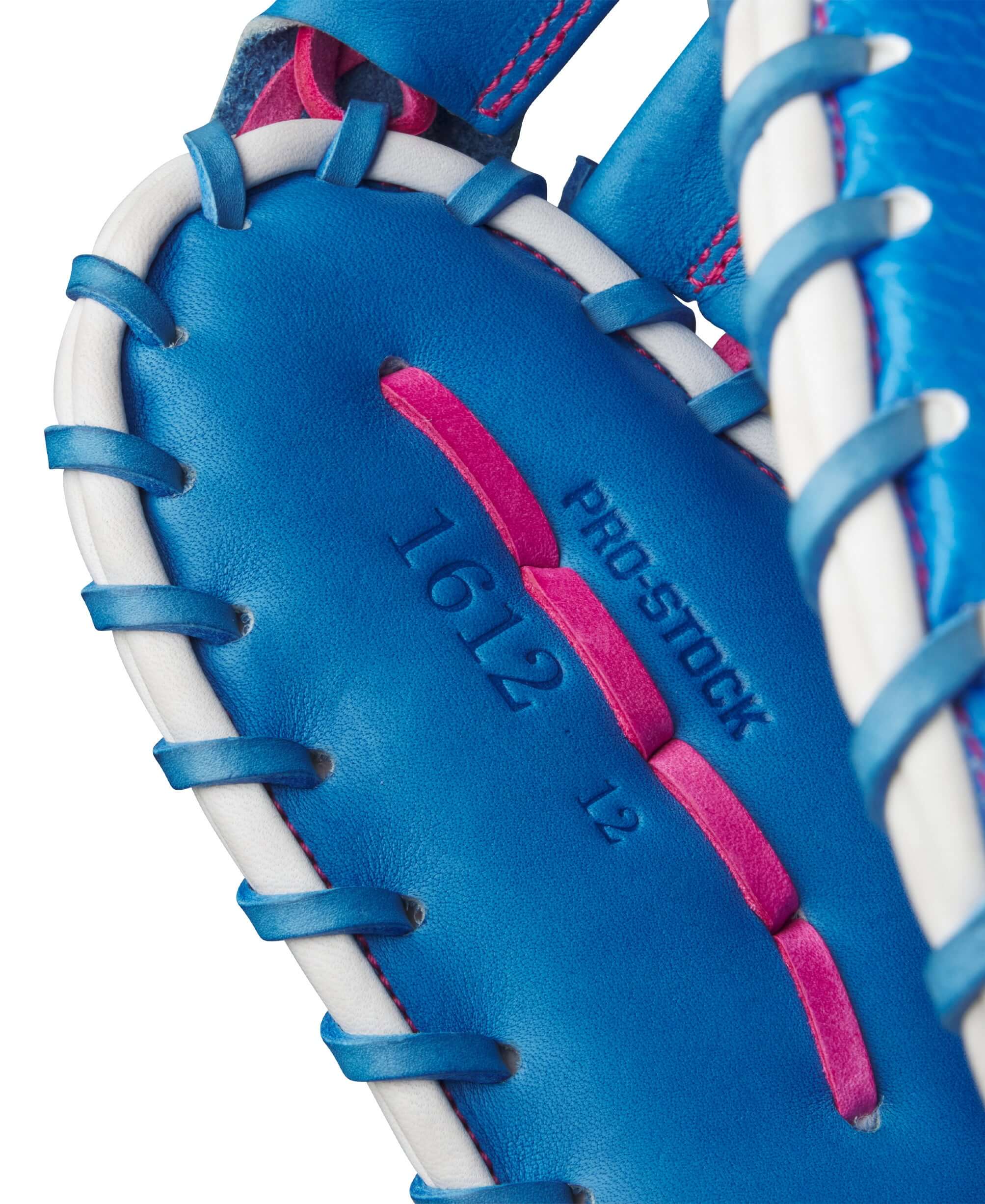 Close-up of the Wilson A2000 1612SS baseball mitt, showcasing pro stock leather and vibrant blue and pink stitching.