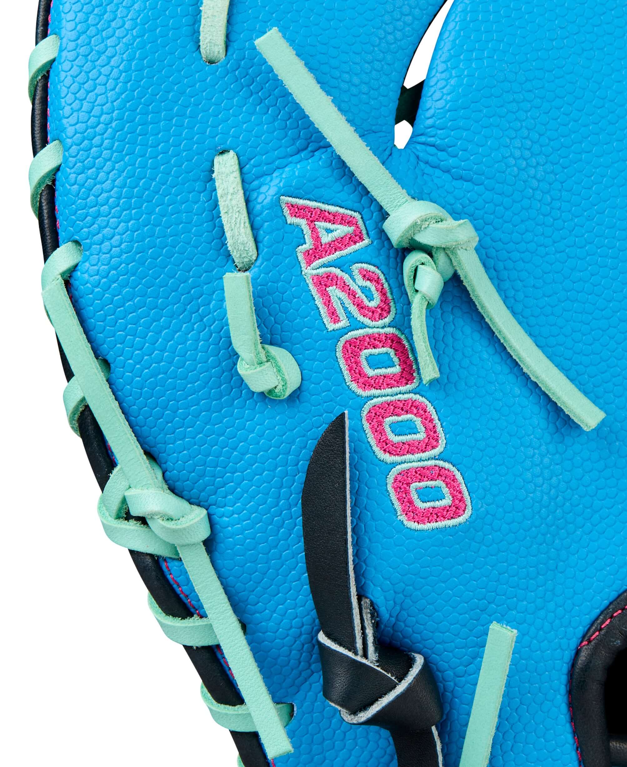 Wilson 2025 A2000 1677SS 12.5” First Base Mitt LHT close-up Wilson A2000 logo in Seafoam/Red.