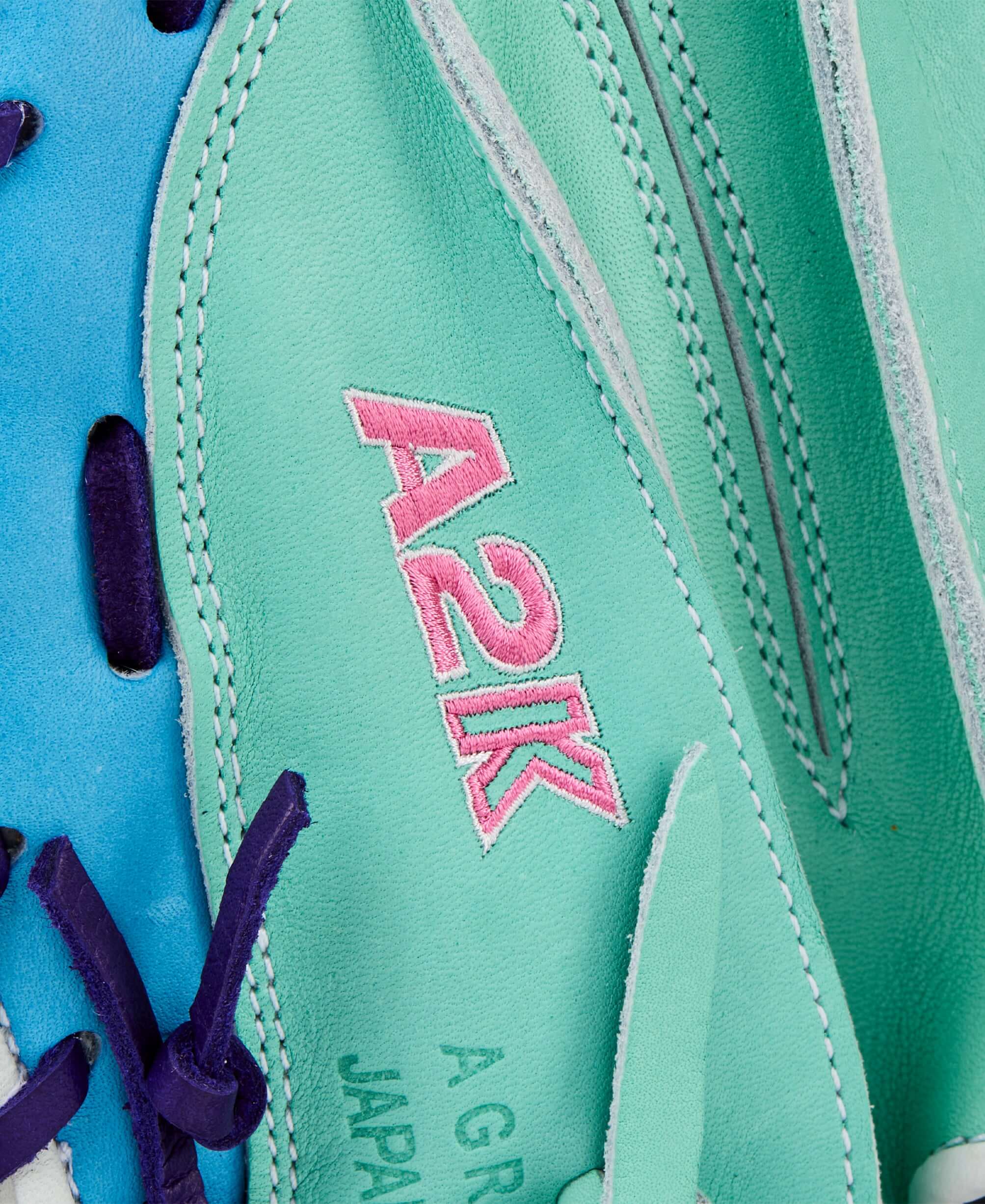 Wilson 2025 A2K 1734 34” Catcher’s Mitt close-up Wilson logo with pink accents.