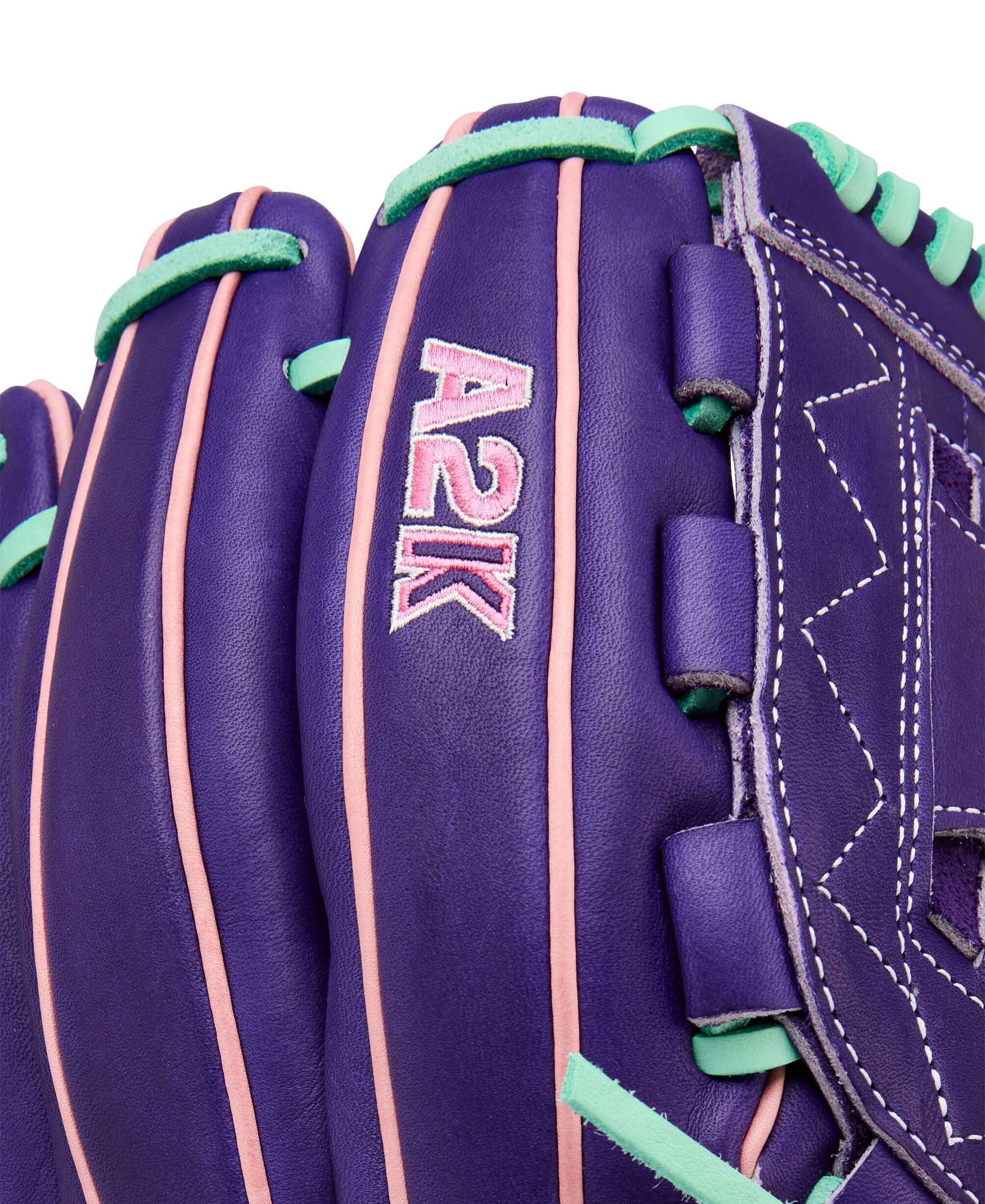 Wilson 2025 A2K C12 12” Pitcher’s Glove close-up Wilson logo with bold pink accents.