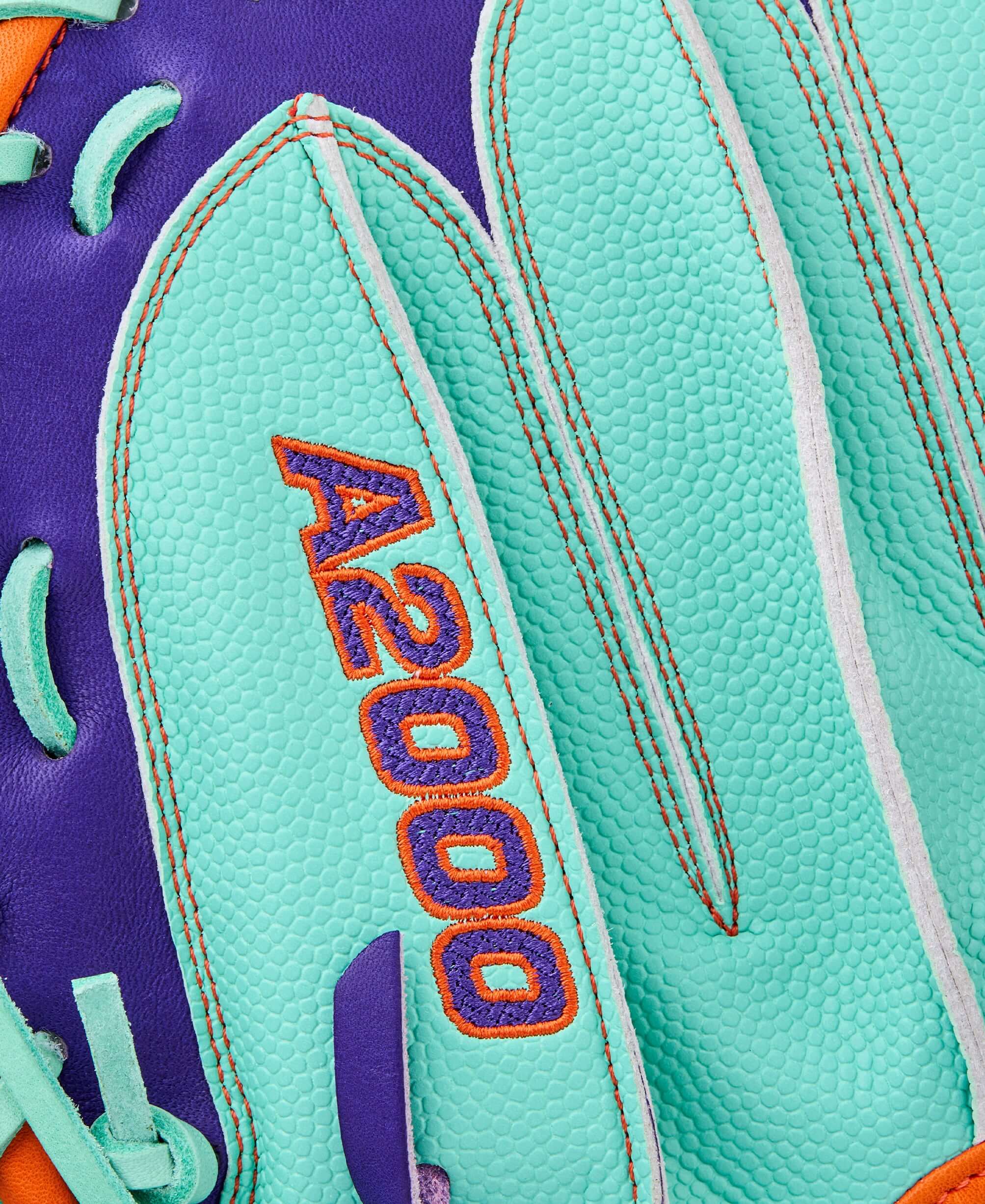 A2000 logo detail on Wilson Winter 2025 A2000 CM33SS 33” Baseball Catcher’s Mitt finger area with Seafoam trim.