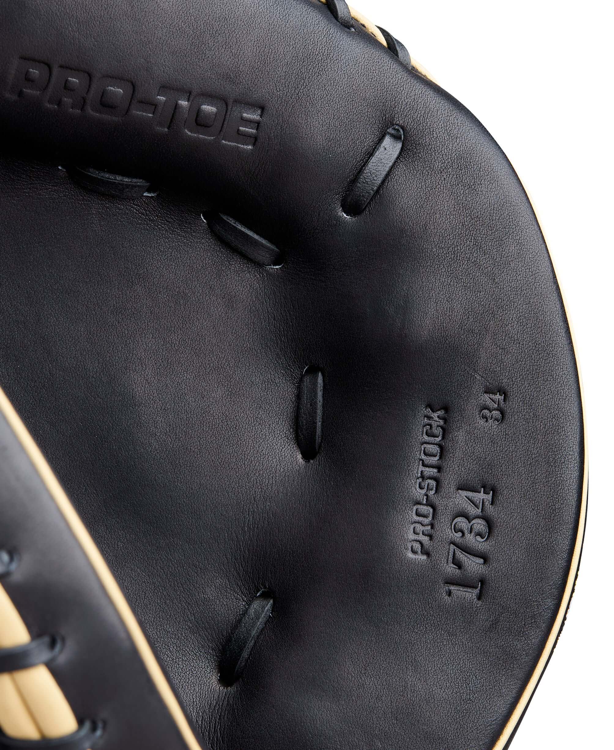 Thumb close-up on 2026 A2000 Classics Series 1734 34” Catcher’s Mitt showing precision stitching and structure.
