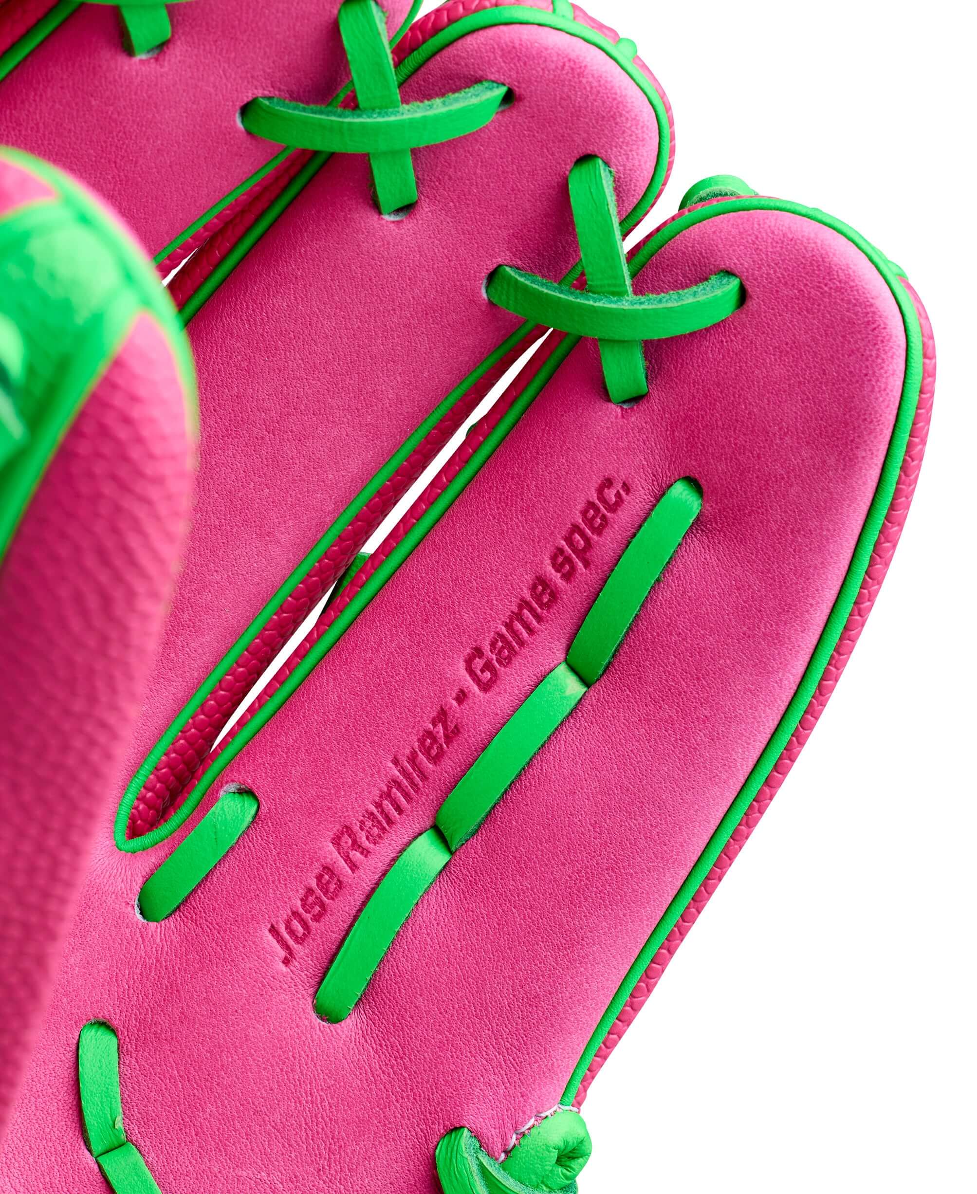 Wilson Spring 2026 José Ramírez A2000 JR11 GM 12” Infield Baseball Glove palm view with pink leather and green lacing.