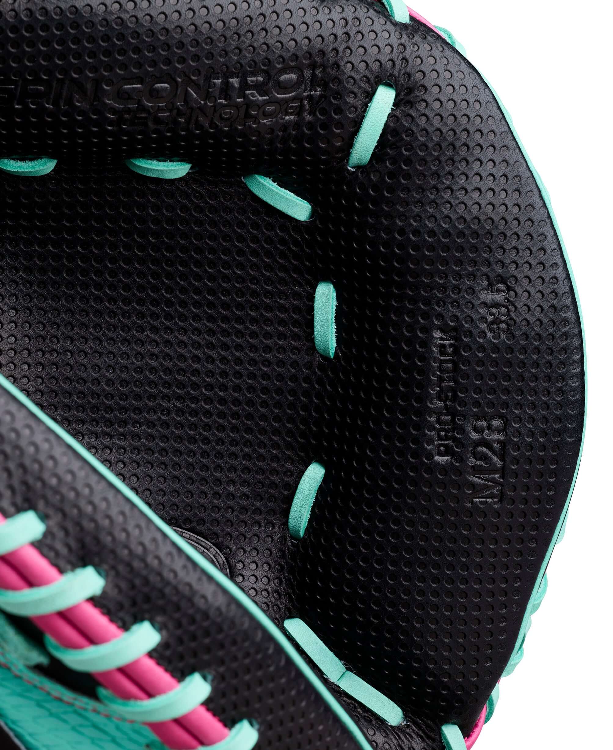 Wilson Spring 2026 A2000 SCM23SS 33.5” Baseball Catcher’s Mitt interior lining with teal laces, black leather, and pink stitching.