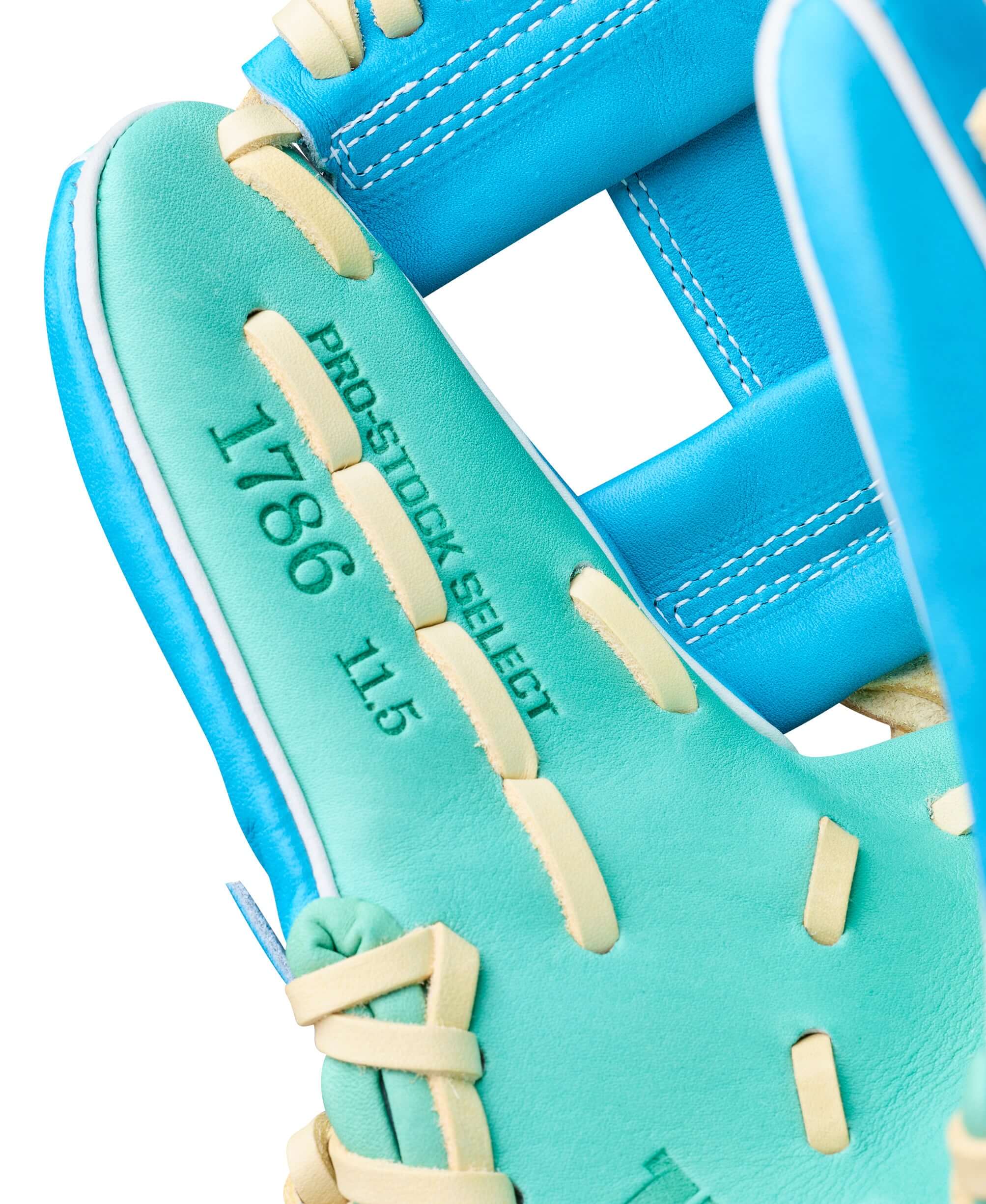 Wilson Spring 2026 A2K 1786 11.5" Infield Baseball Glove palm view with blue-green leather and tan lacing detail.