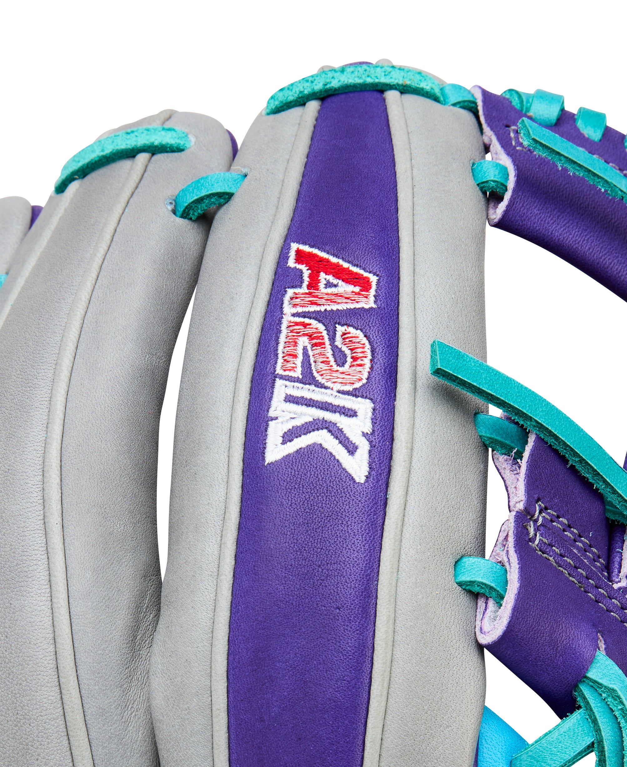 Close-up of Wilson Spring 2026 A2K MB1975 11.75" Infield Baseball Glove with purple and grey leather detail.