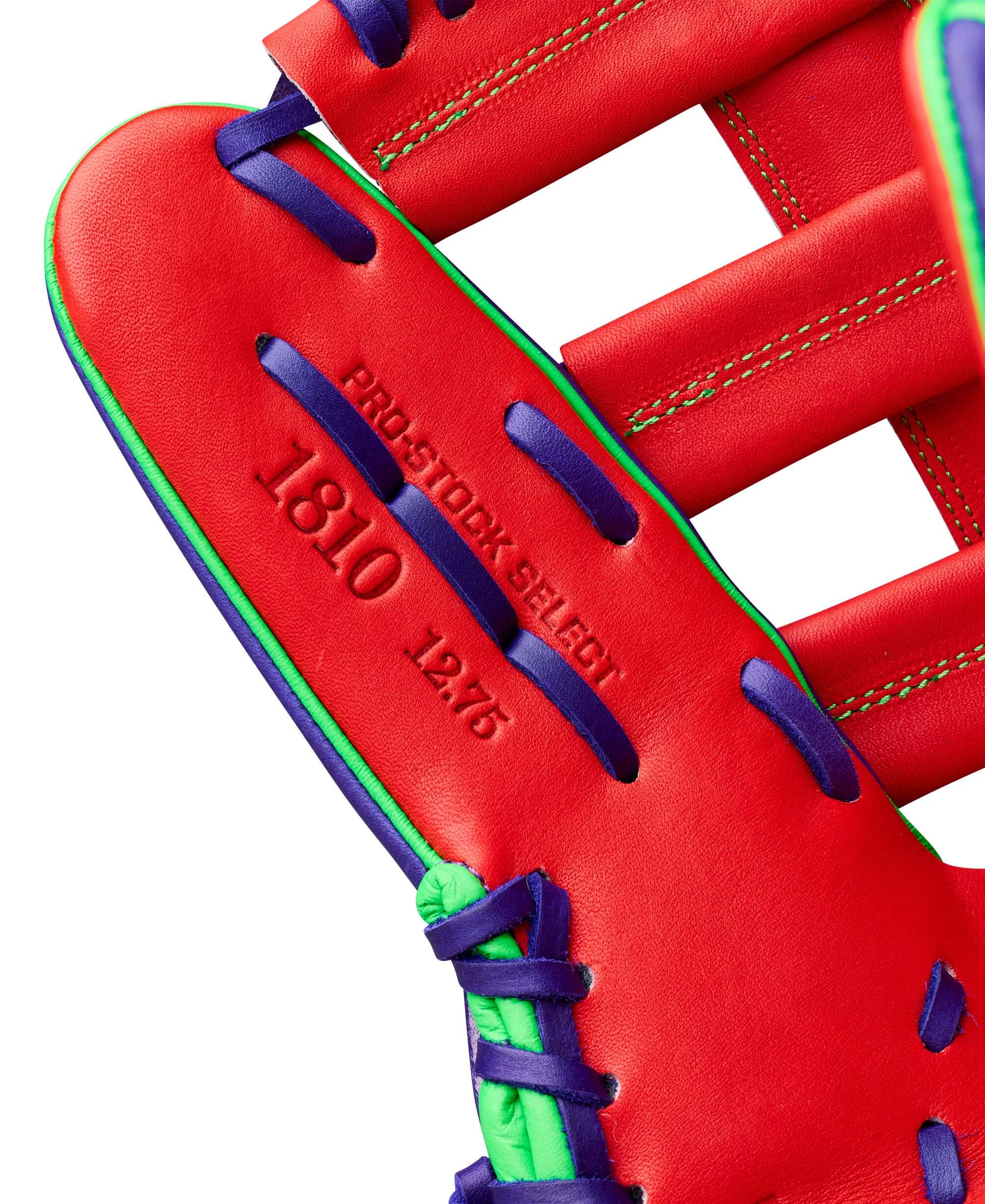 Wilson Spring 2026 A2K 1810 12.75" Outfield Baseball Glove Purple/Red, web detail with Pro Stock logo and blue lacing.