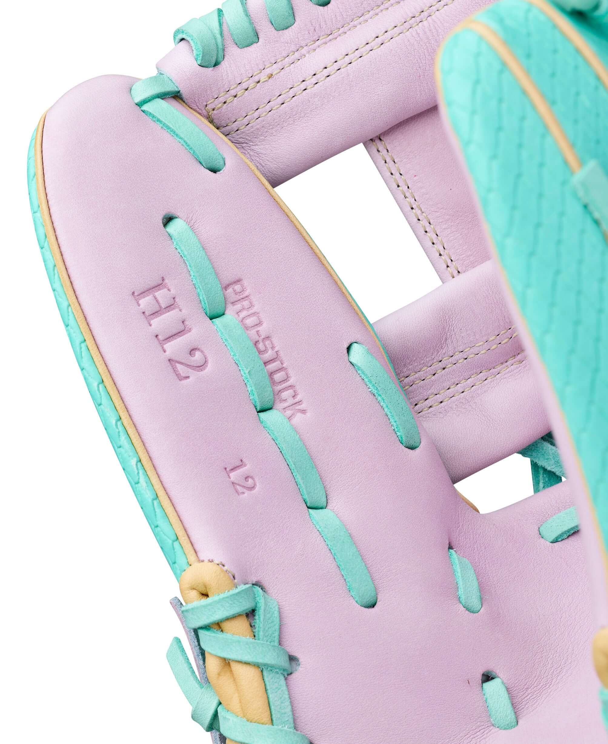 Close-up of Wilson Spring 2026 A2000 H12SS 12" Fastpitch Softball Glove interior lining with purple and teal lacing.