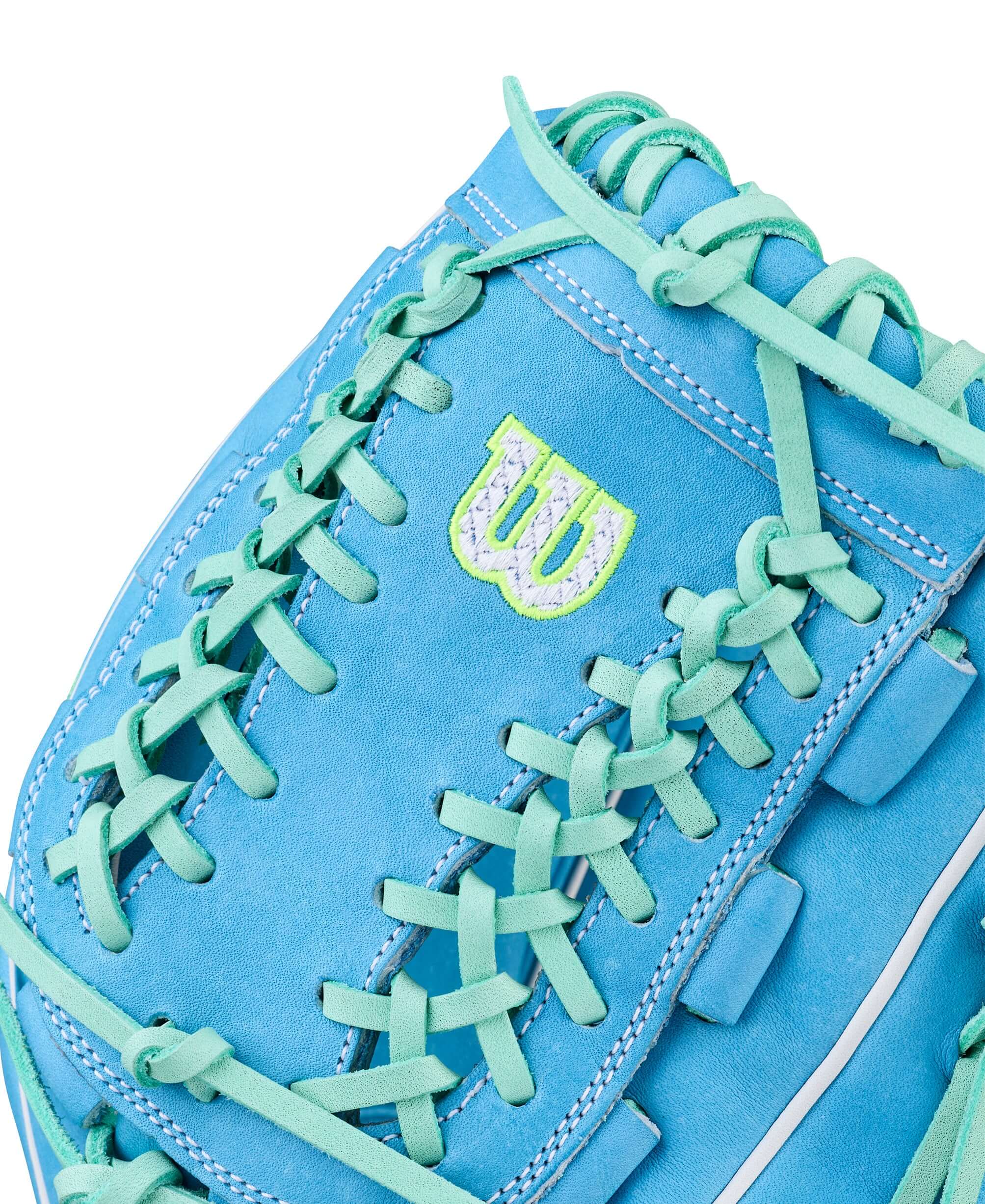Wilson Spring 2026 A2000 FPHG 12” Pitcher’s Fastpitch Softball Glove, web detail showing blue leather and lacing with logo patch.